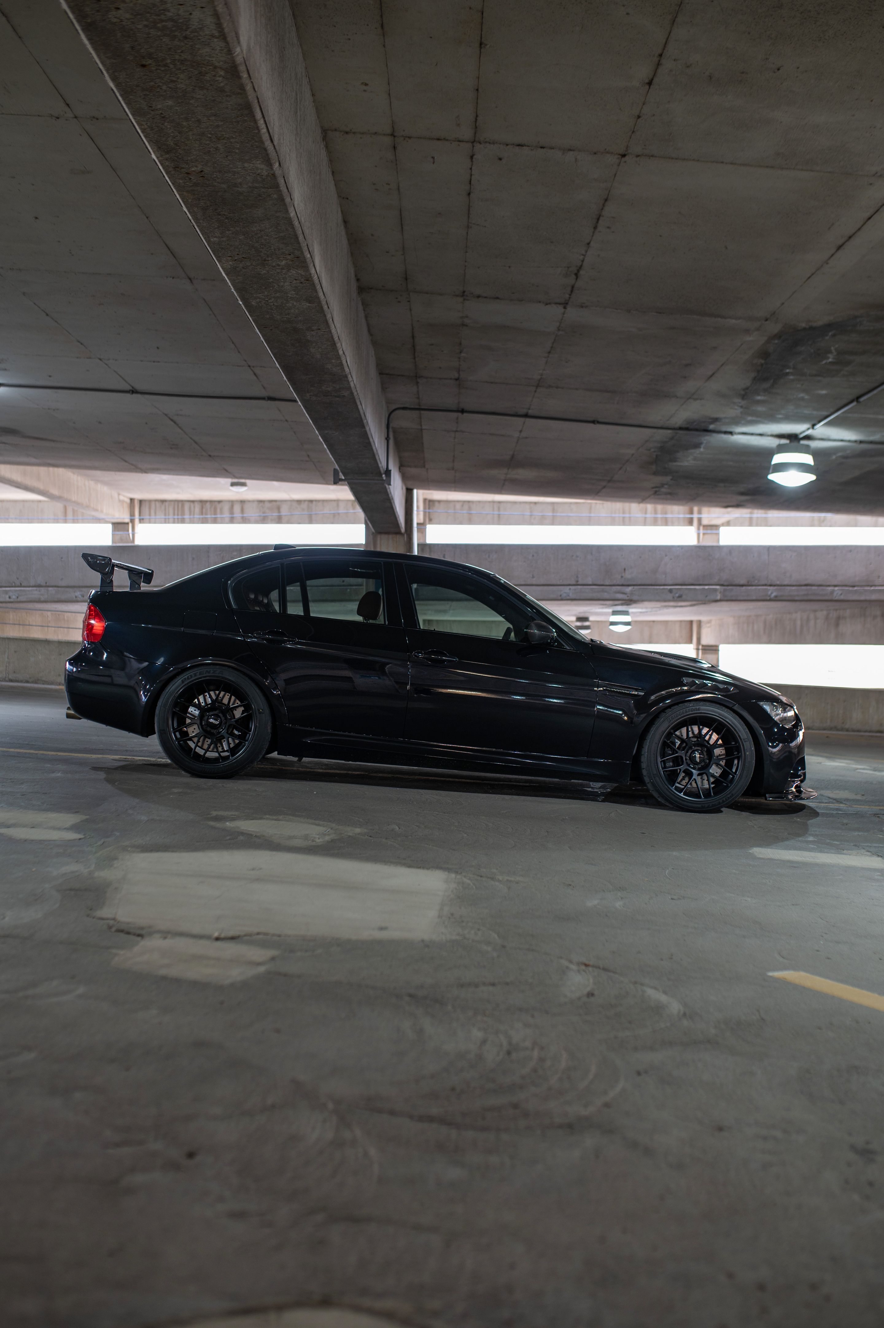 Black BMW E90 Sedan M3 with 18" ARC-8 Apex wheels in Satin Black