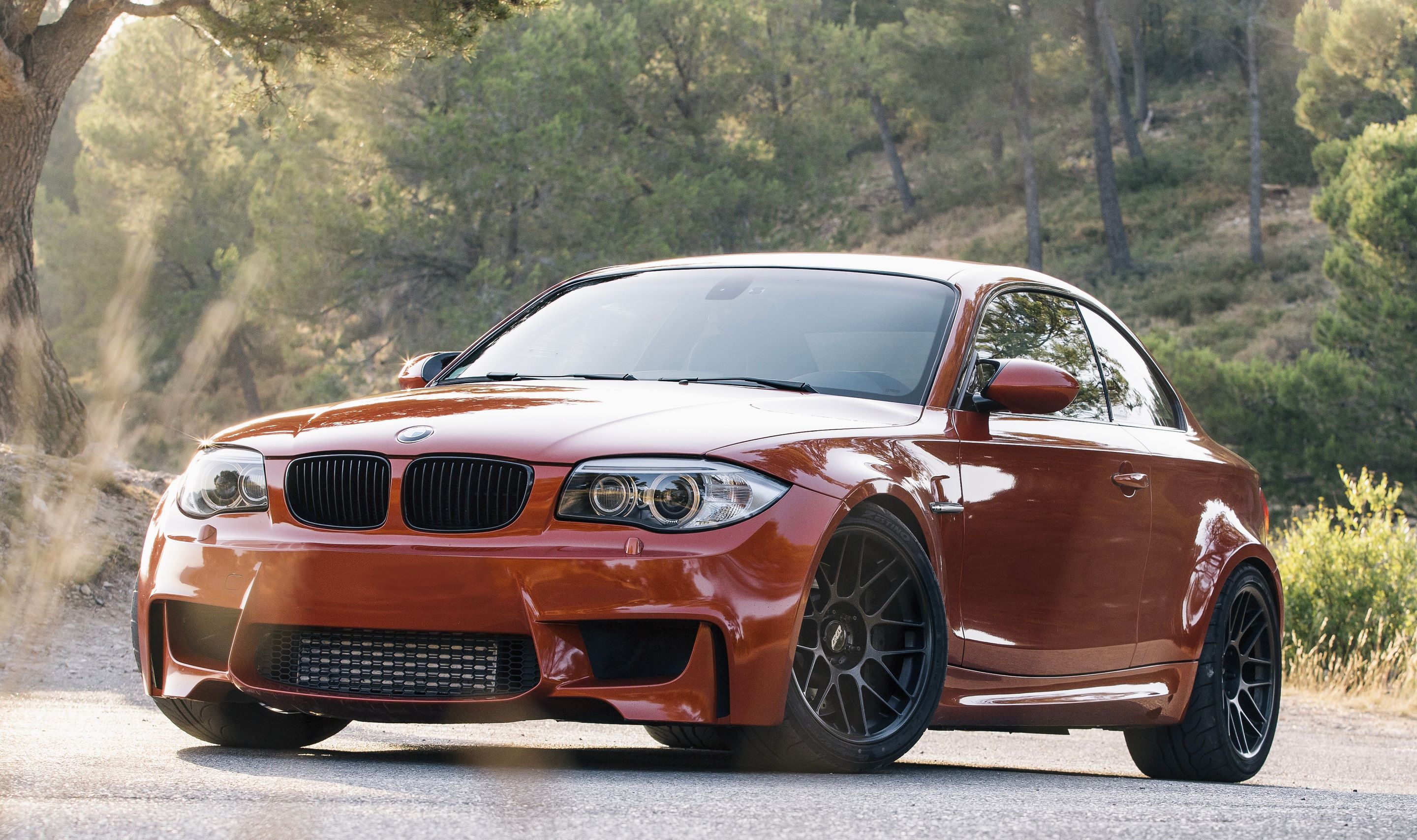 Orange BMW E82 1M with 18" ARC-8 Apex wheels in Satin Black