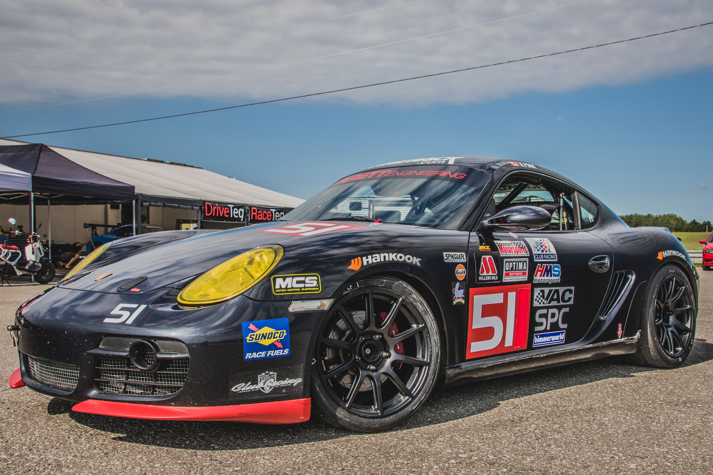 Black Porsche 987 Spec Cayman (SPC) with 18" SM-10 Apex wheels in Satin Black