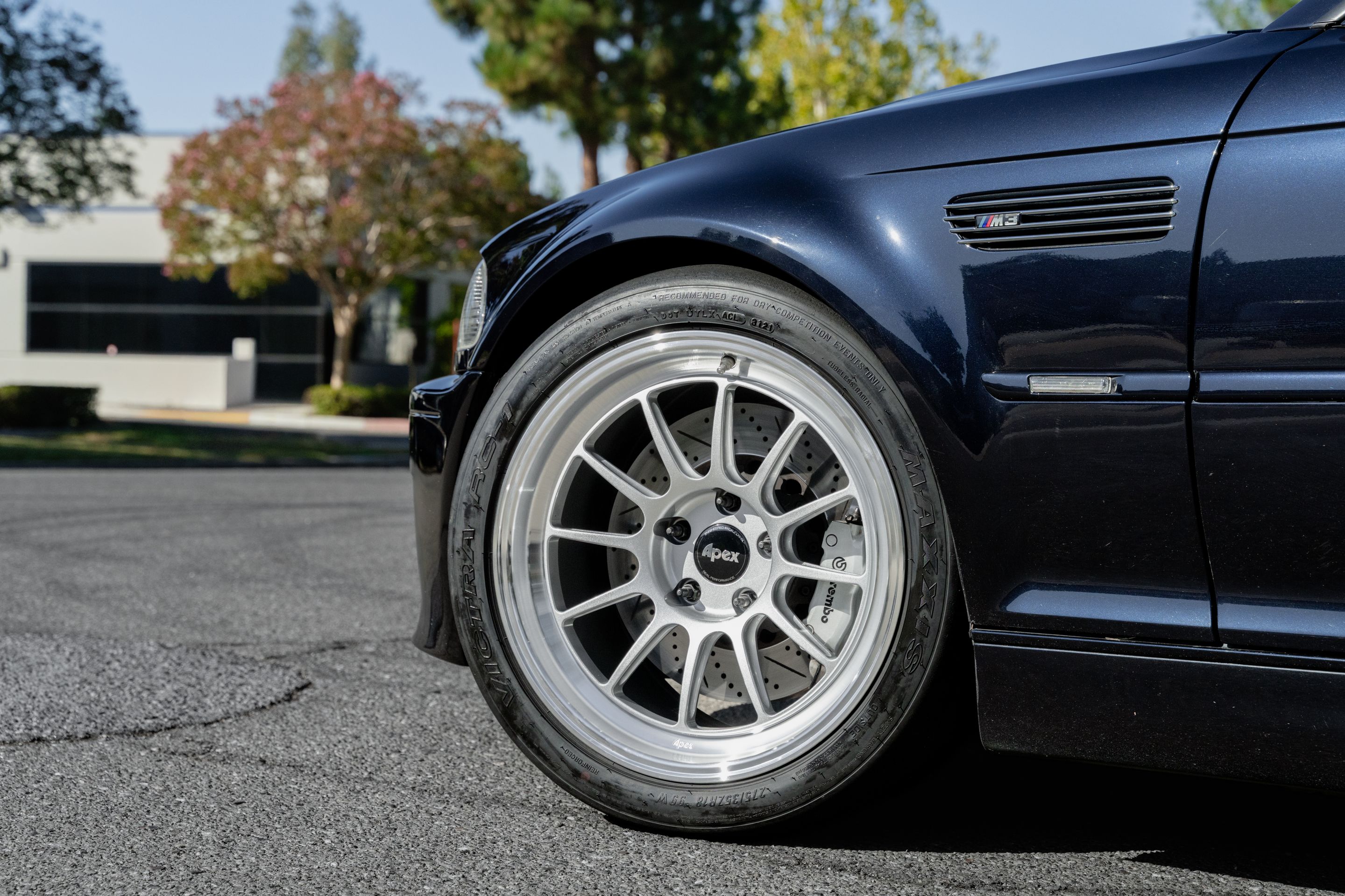 Black BMW E46 M3 with 18" SL-12 Apex wheels in Machined Lip Race Silver