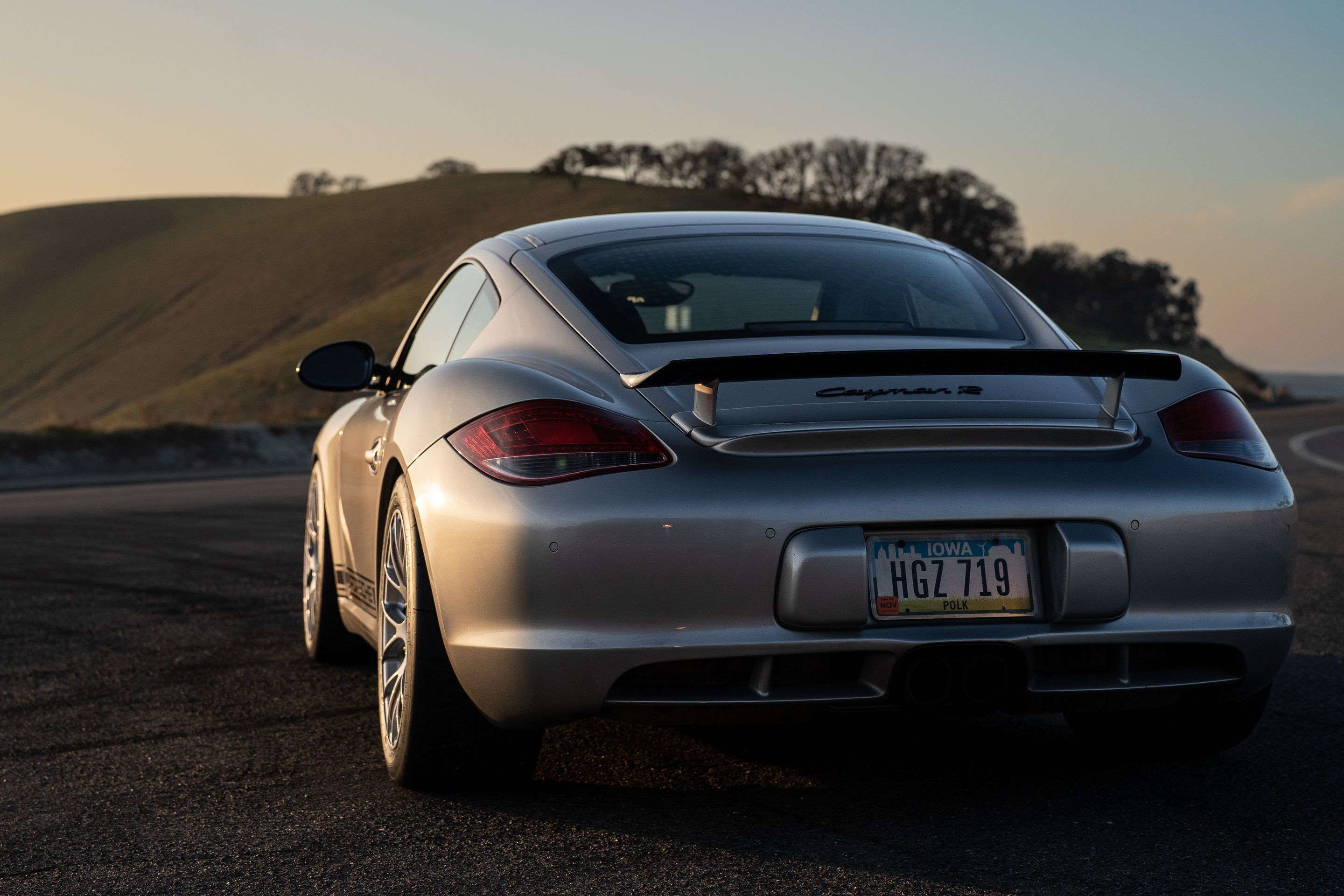 Grey Porsche 987 Cayman R with 18" EC-7RS Apex wheels in Race Silver