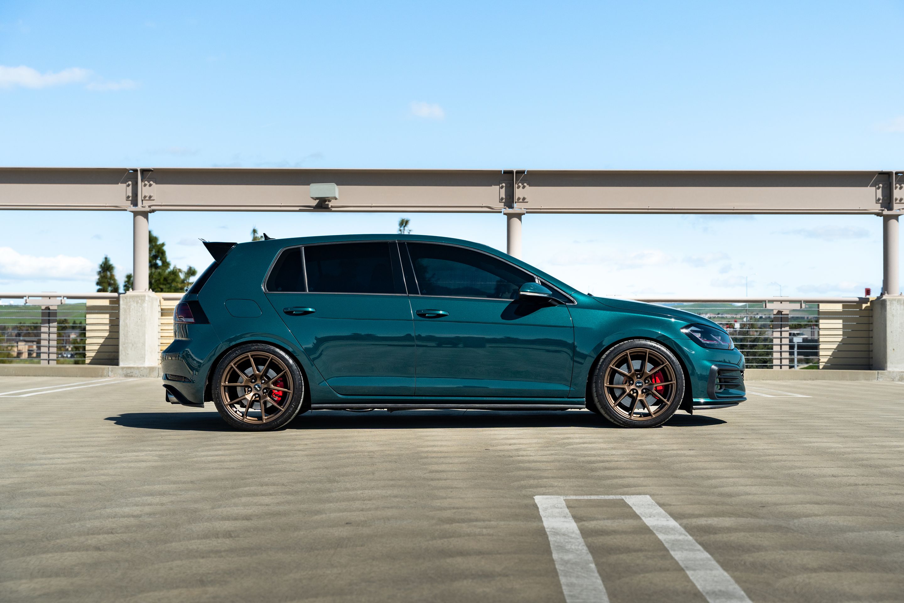 Green VW MK7 GTI with 18" VS-5 Apex wheels in Satin Bronze