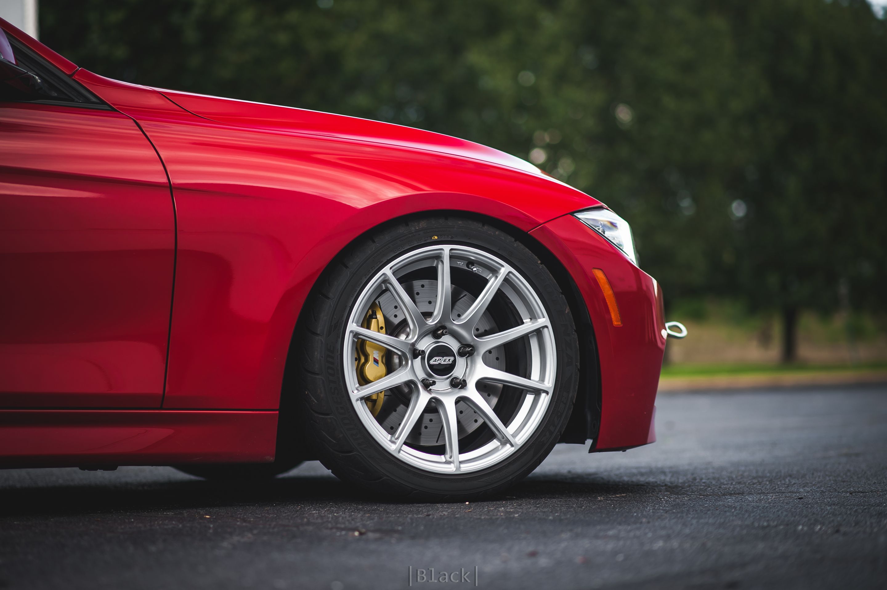 Red BMW F31 Wagon 3 Series with 18" SM-10 Apex wheels in Race Silver