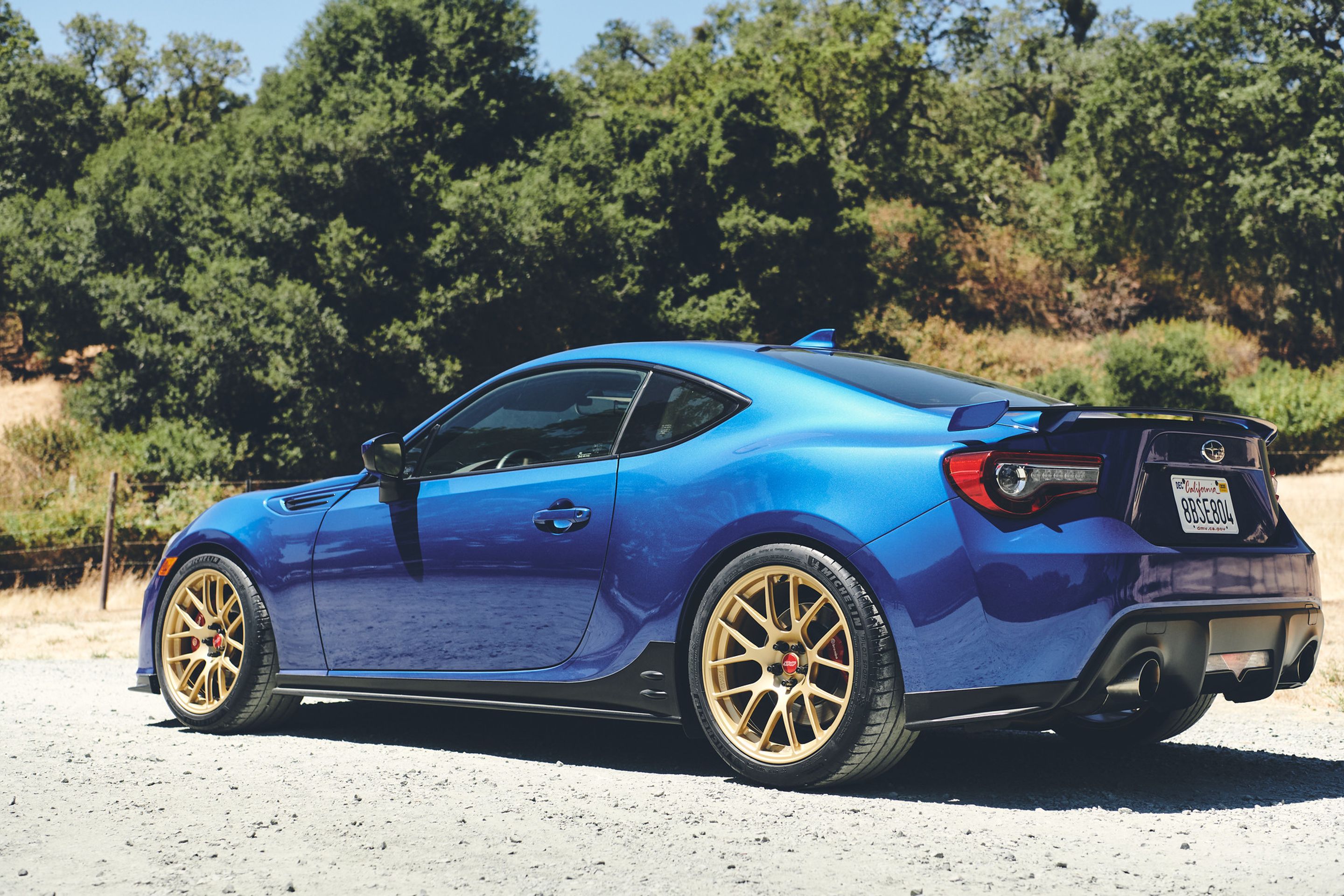 Blue Subaru ZC6 / Gen 1 BRZ with 17" EC-7R Apex wheels in Satin Gold