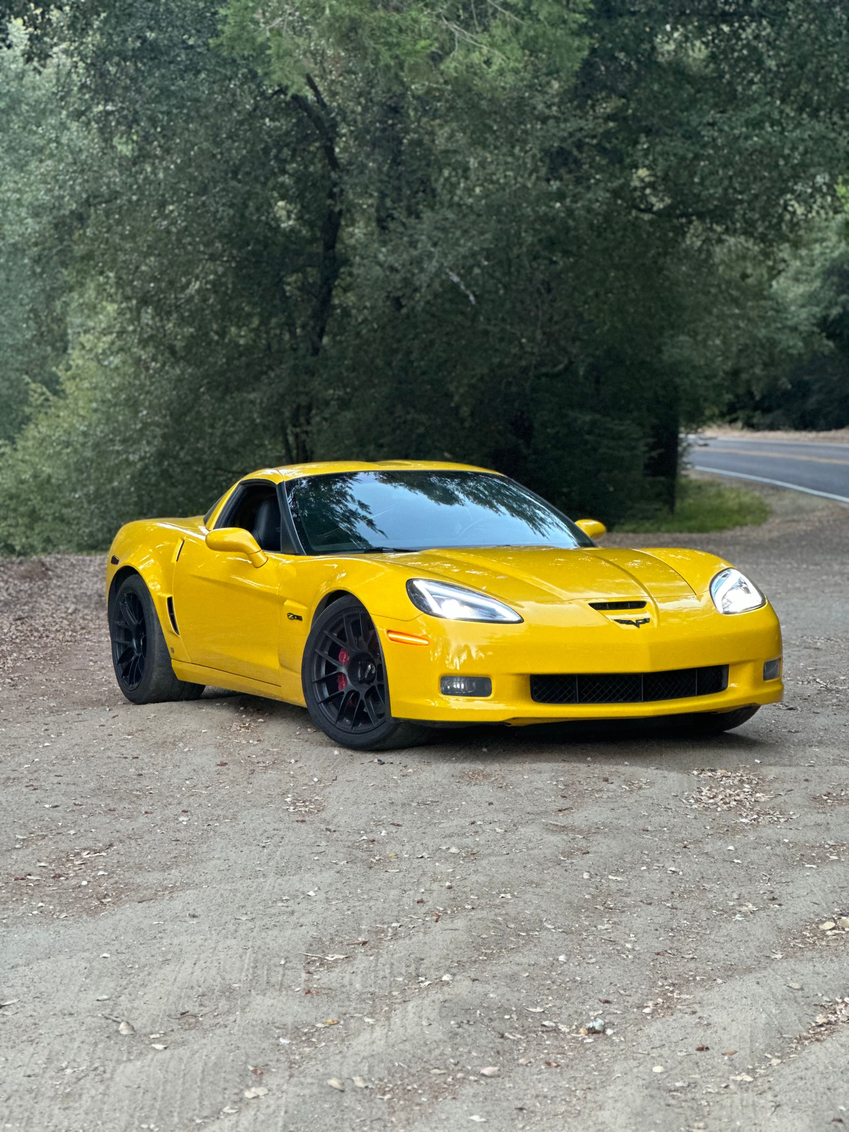 Yellow Chevrolet C6 Corvette Z06 with 19" EC-7RS Apex wheels in Satin Black
