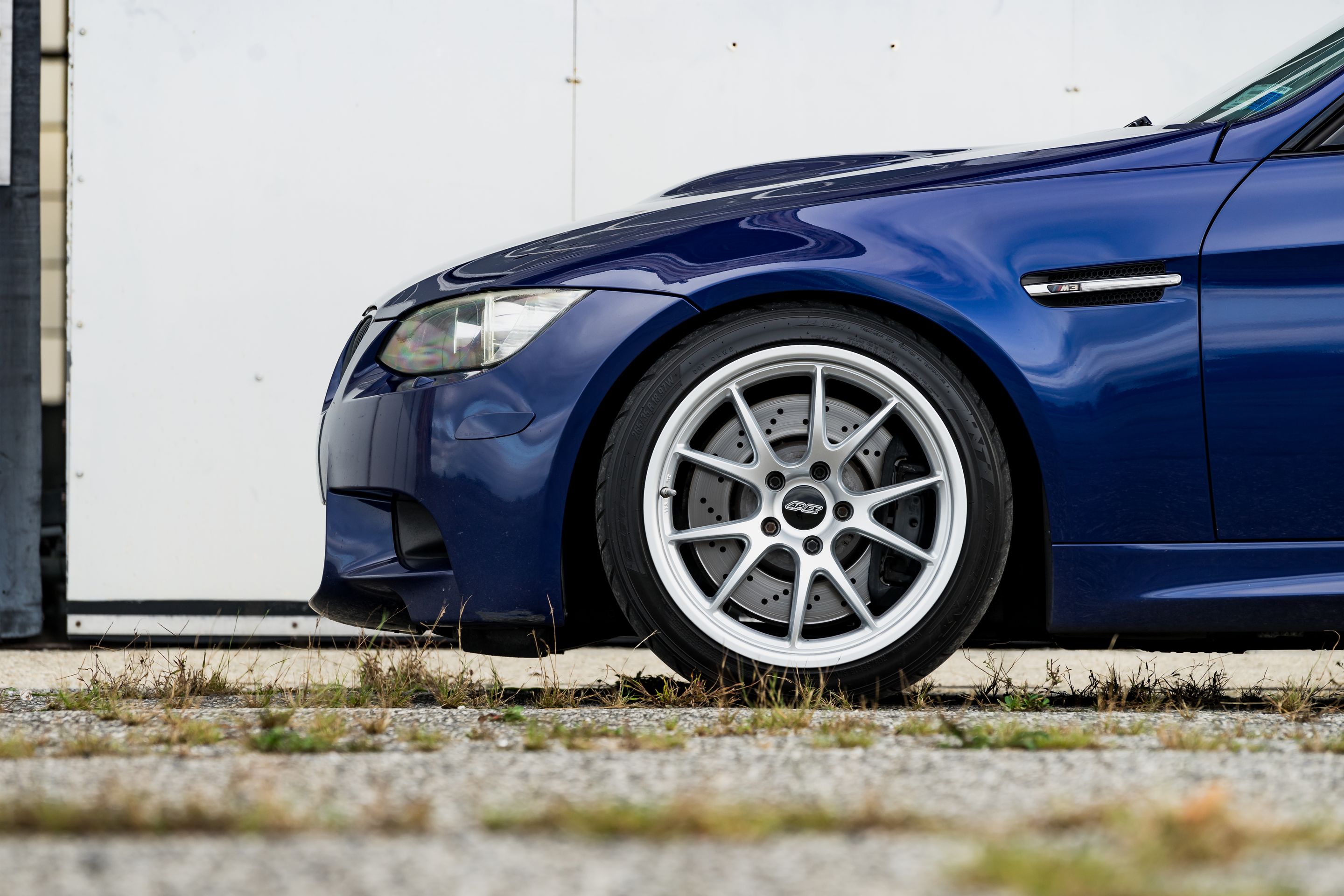 Blue BMW E90 Sedan M3 with 18" FL-5 Apex wheels in Race Silver