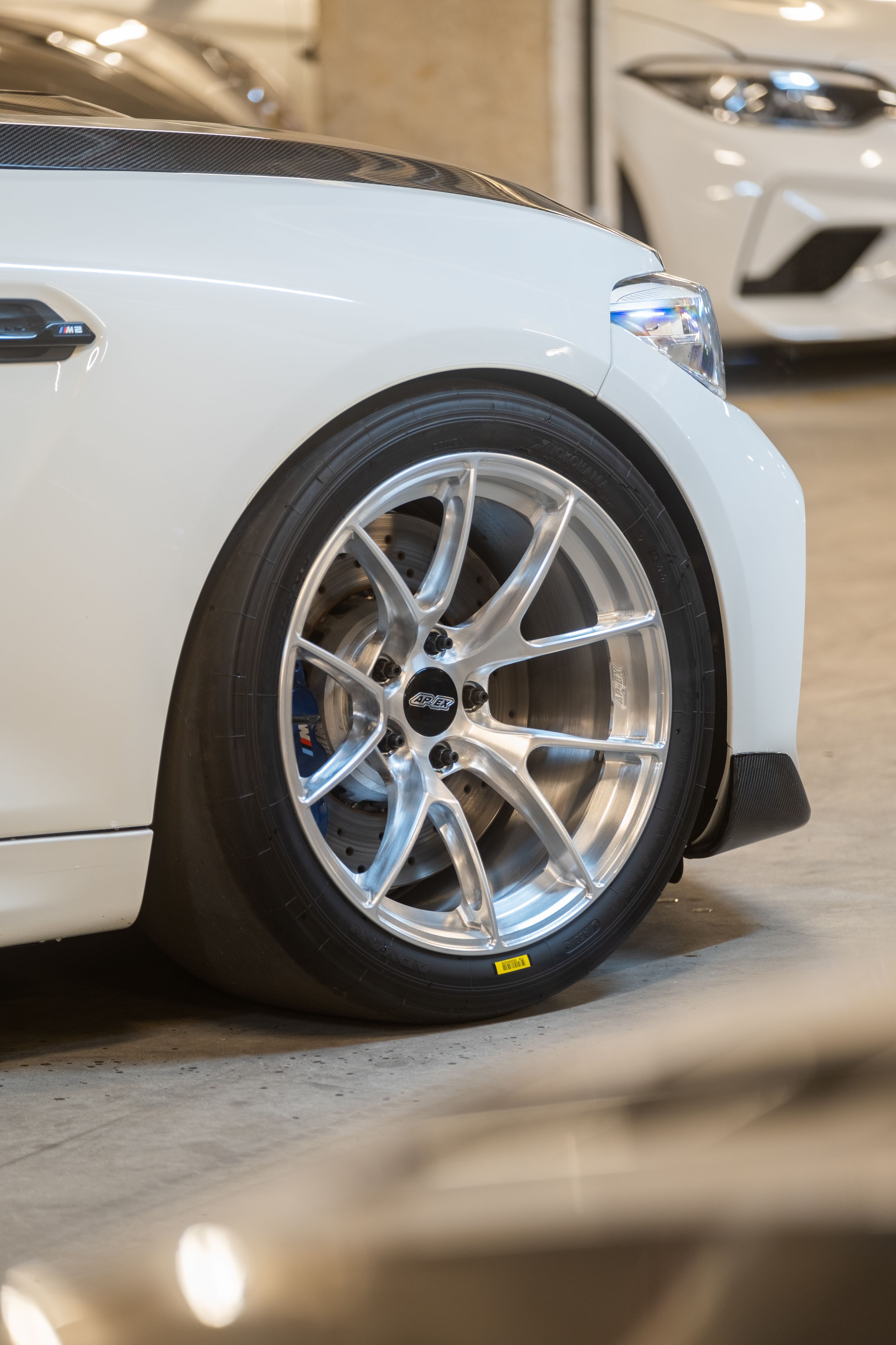 White BMW F87 M2 with 18" VS-5RS Apex wheels in Brushed Clear