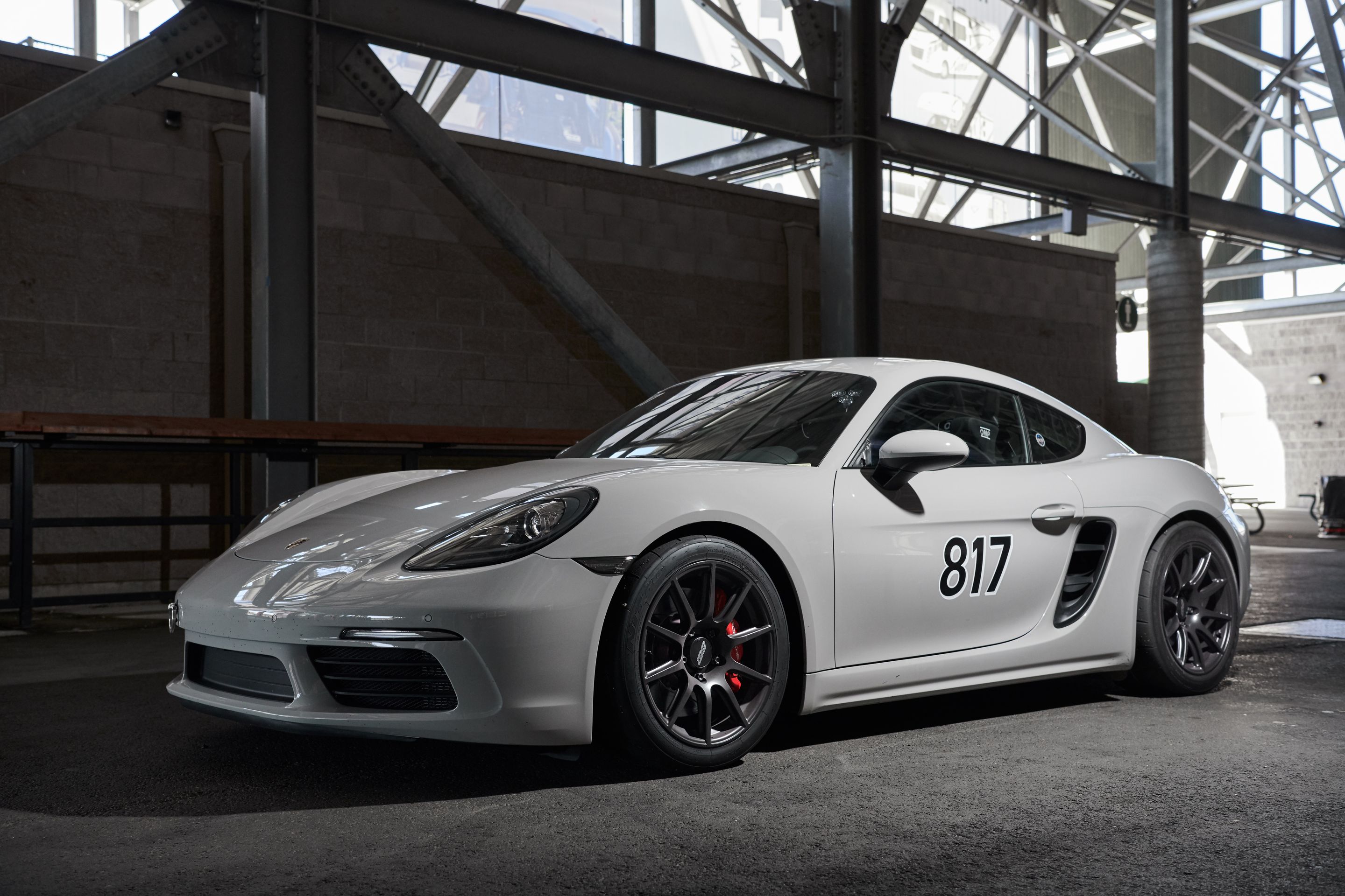 White Porsche 718 Cayman S with 18" SM-10 Apex wheels in Satin Black