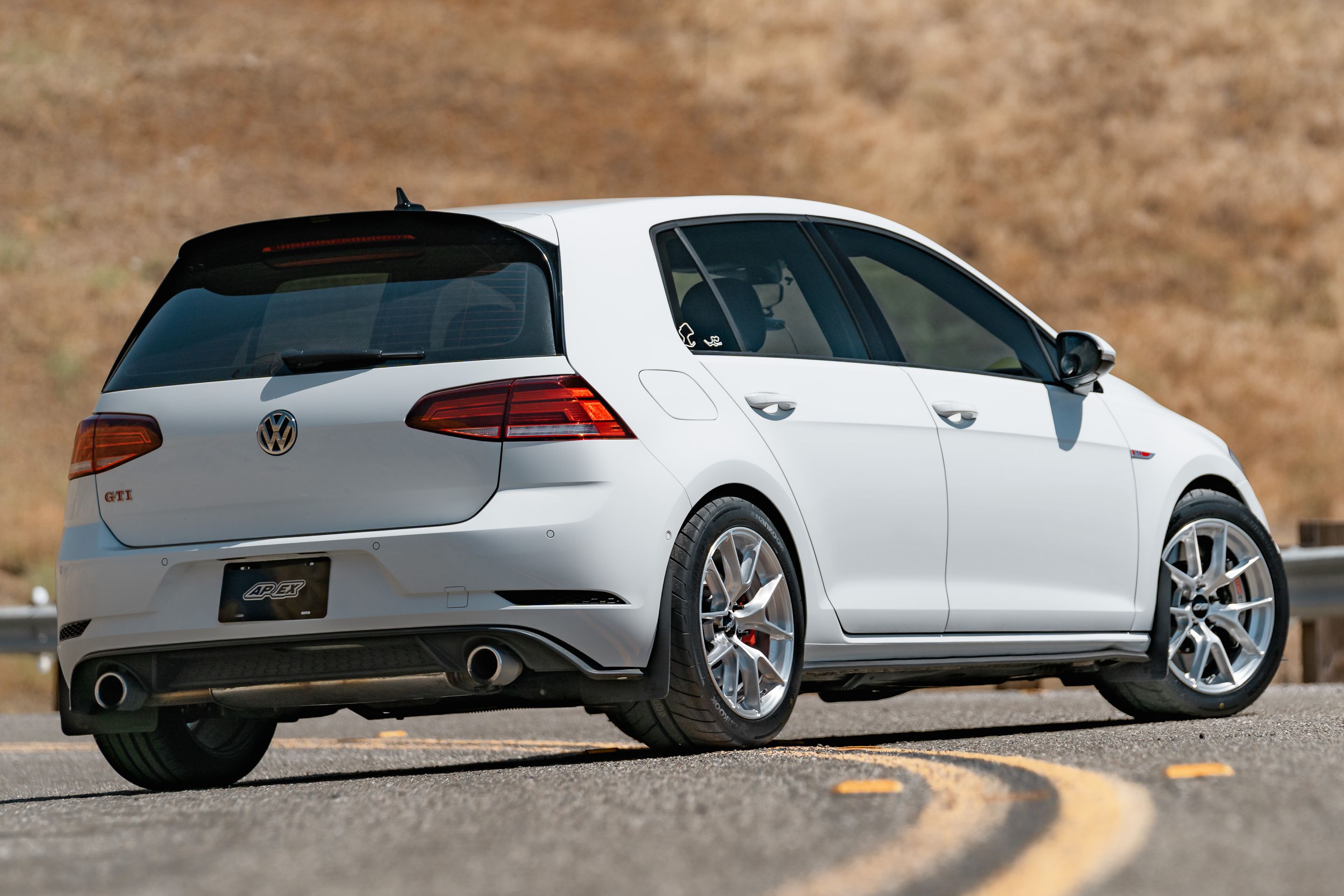 White VW MK7 GTI with 17" VS-5RS Apex wheels in Brushed Clear
