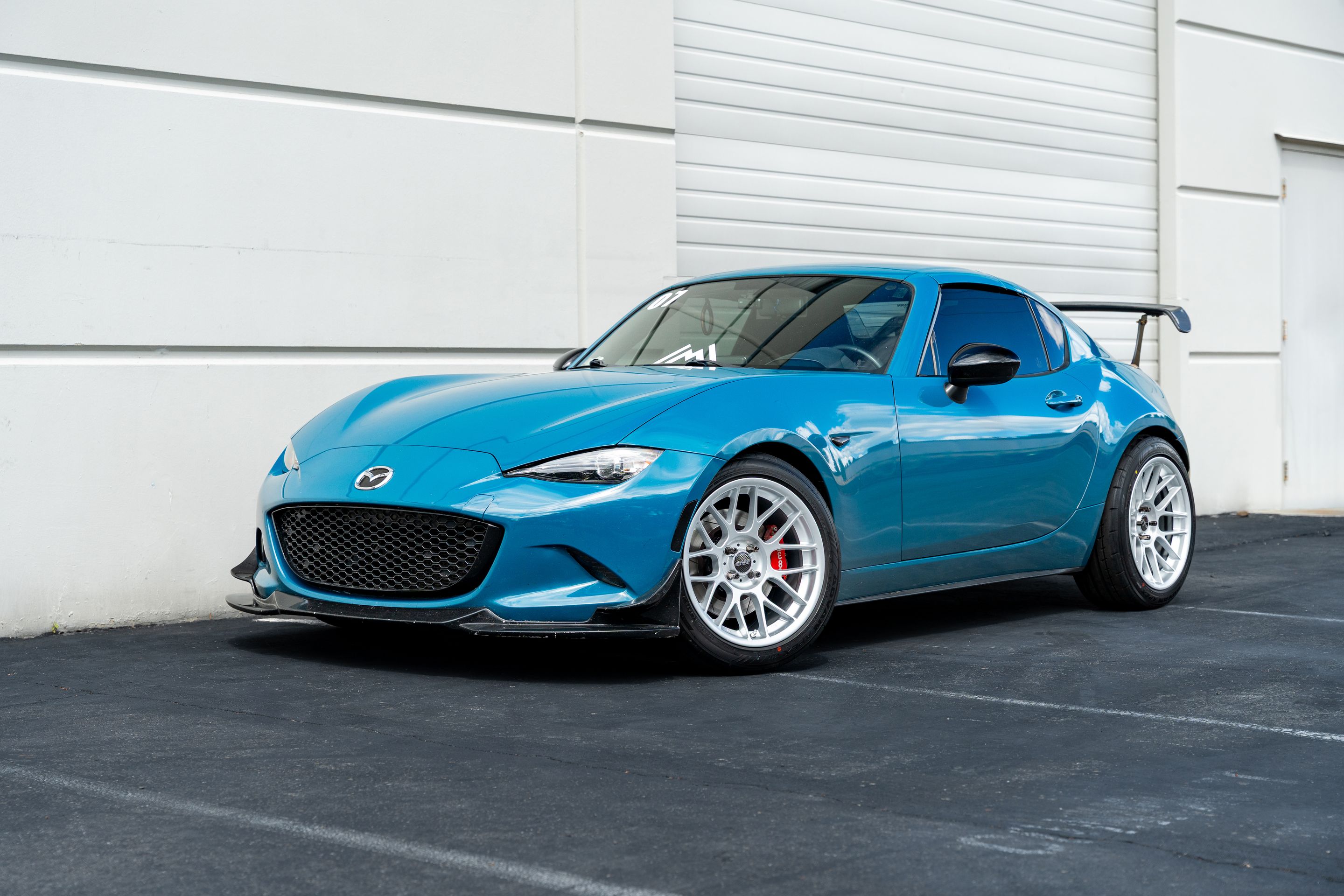 Blue Mazda ND MX-5 Miata with 17" ARC-8 Apex wheels in Race Silver