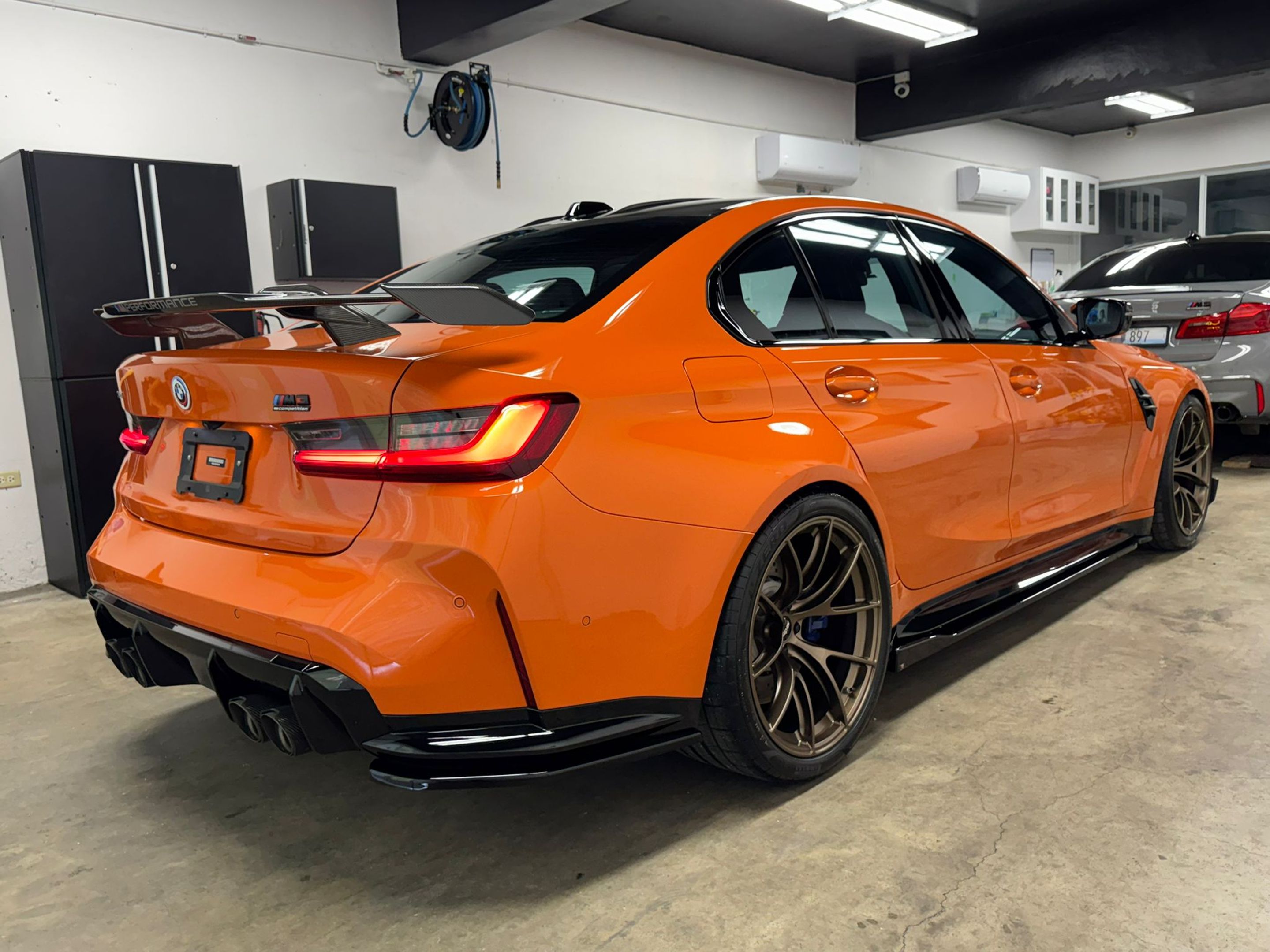 Orange BMW G80 M3 with 20" VS-5RS Apex wheels in Satin Bronze