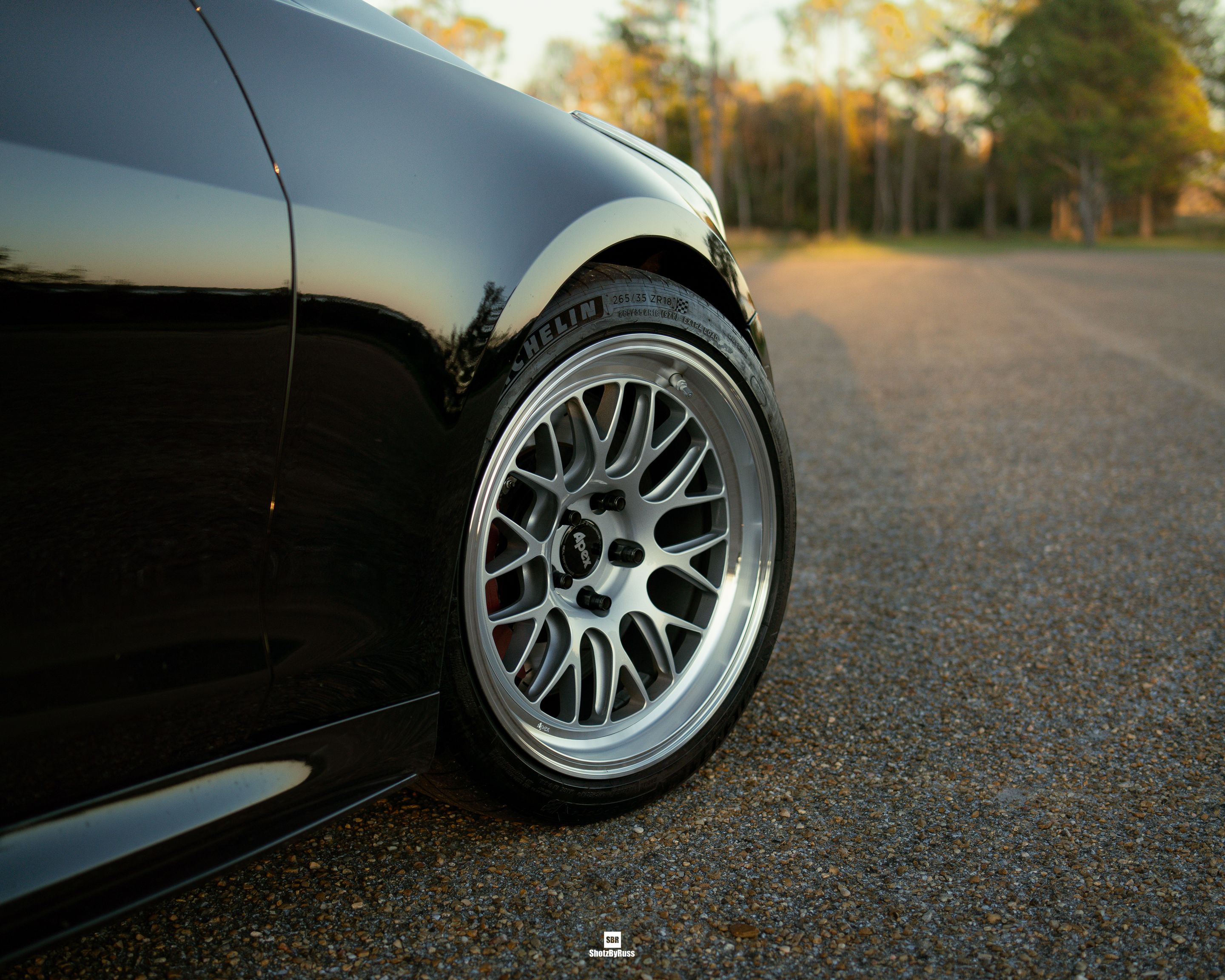 Black Cadillac ATS-V with 18" ML-10RT Apex wheels in Machined Lip Race Silver
