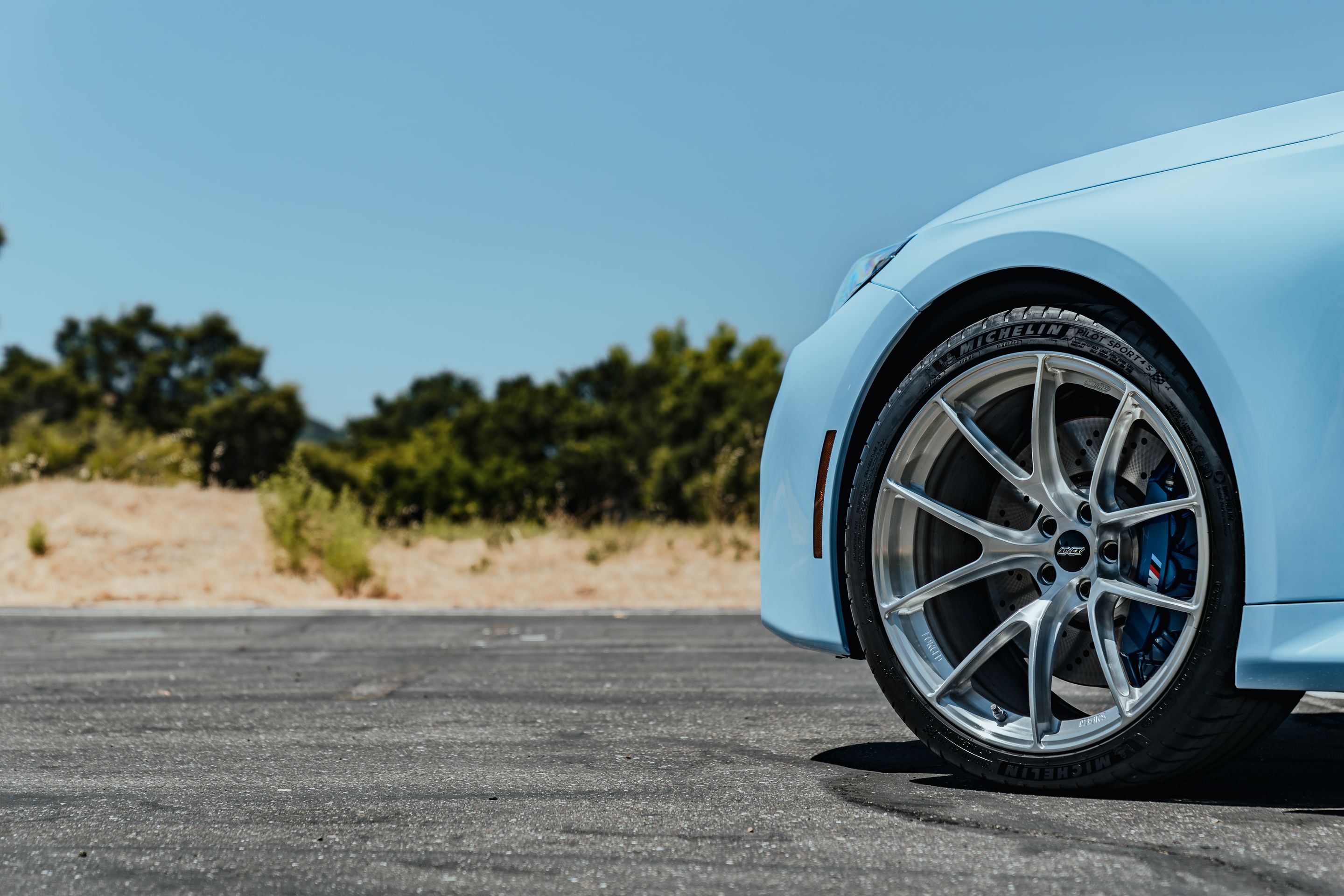 Blue BMW G87 M2 with 20" VS-5RS Apex wheels in Brushed Clear