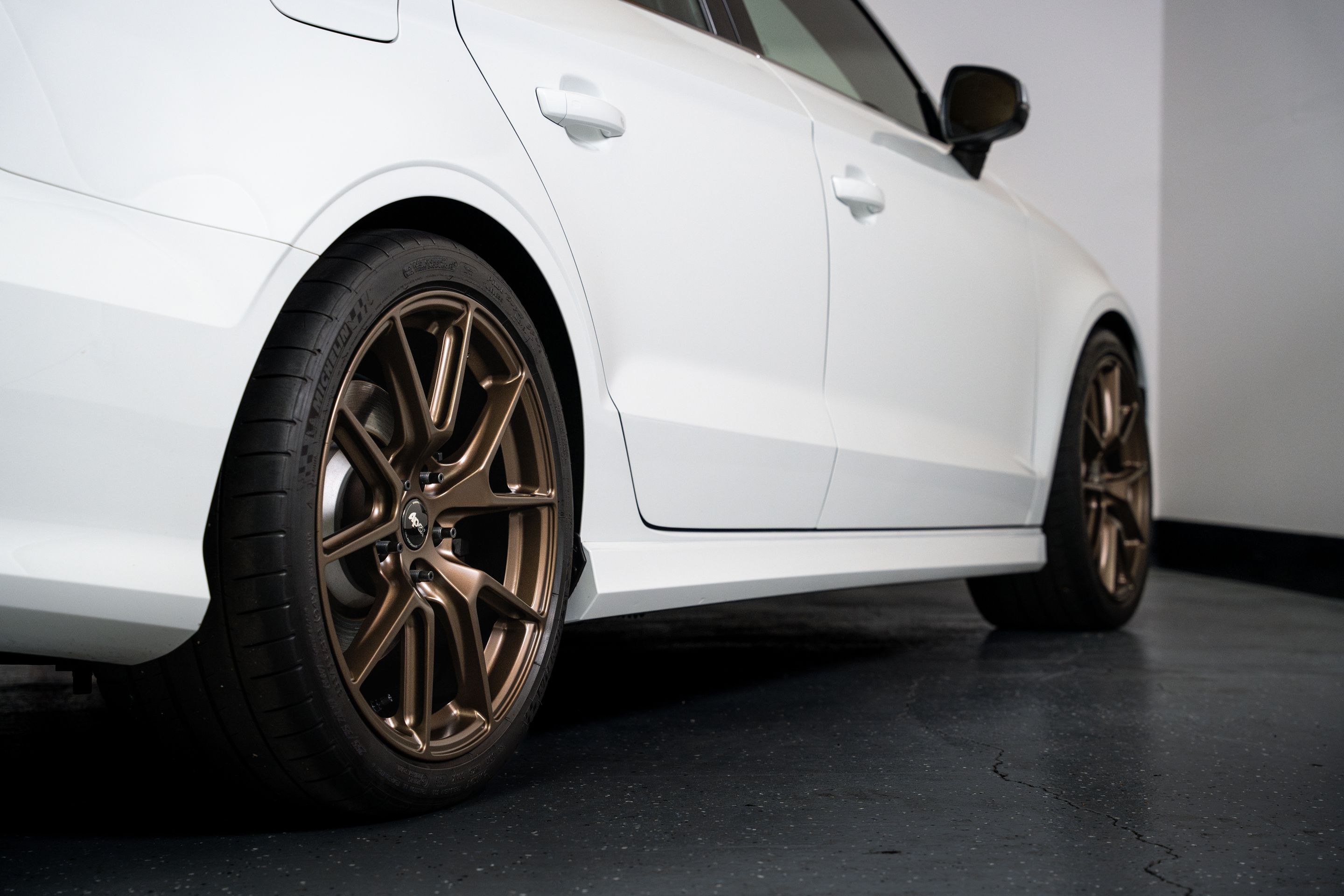 White Audi 8V S3 with 18" VS-5 Apex wheels in Satin Bronze