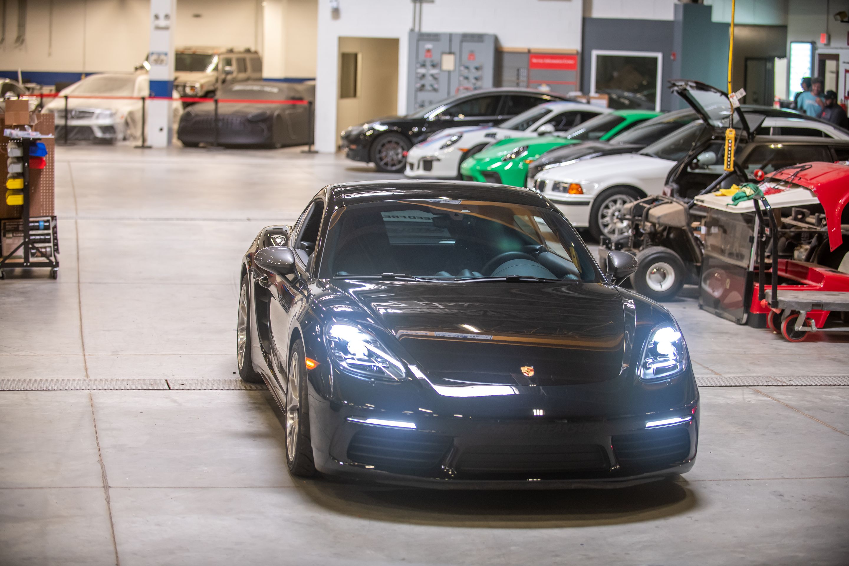 Black Porsche 718 Cayman T with 18" VS-5RS Apex wheels in Brushed Clear