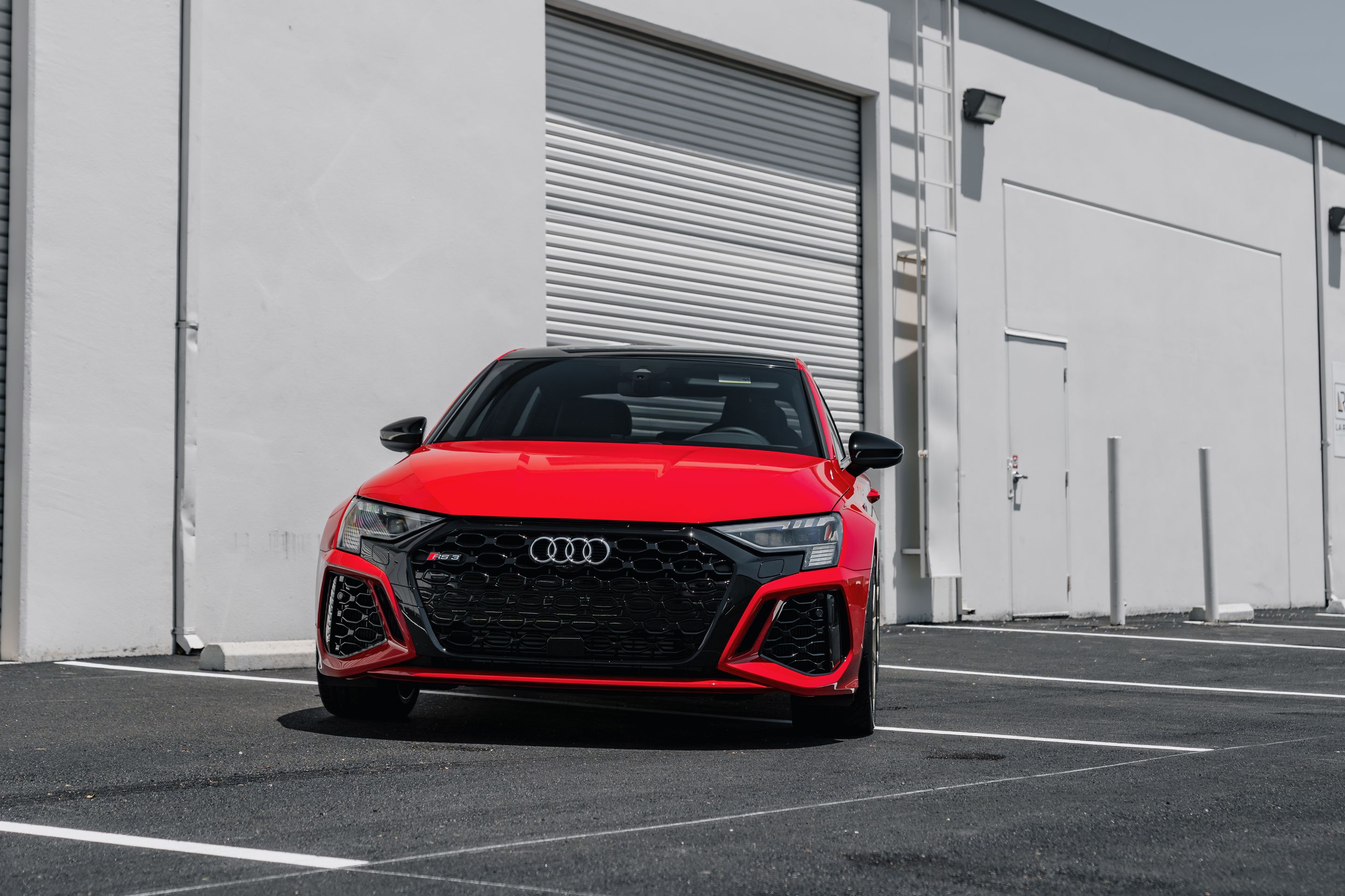 Red Audi 8Y RS 3 with 18" SM-10RS Apex wheels in Motorsport Gold