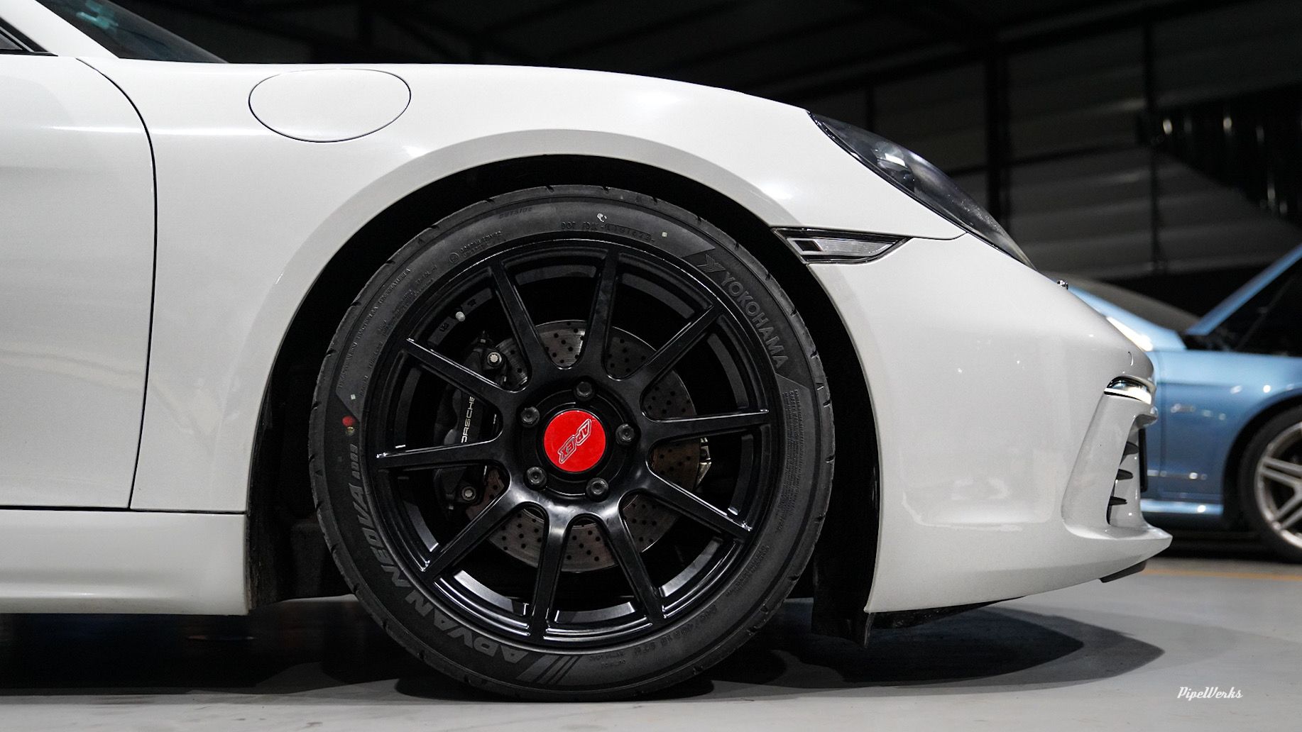 White Porsche 718 Cayman Base with 18" SM-10 Apex wheels in Satin Black
