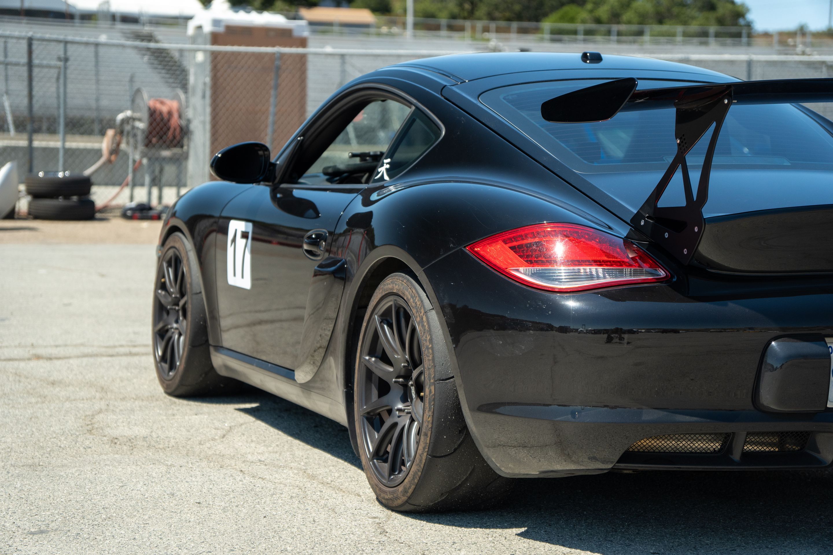 Black Porsche 987 Cayman S with 18" SM-10 Apex wheels in Satin Black
