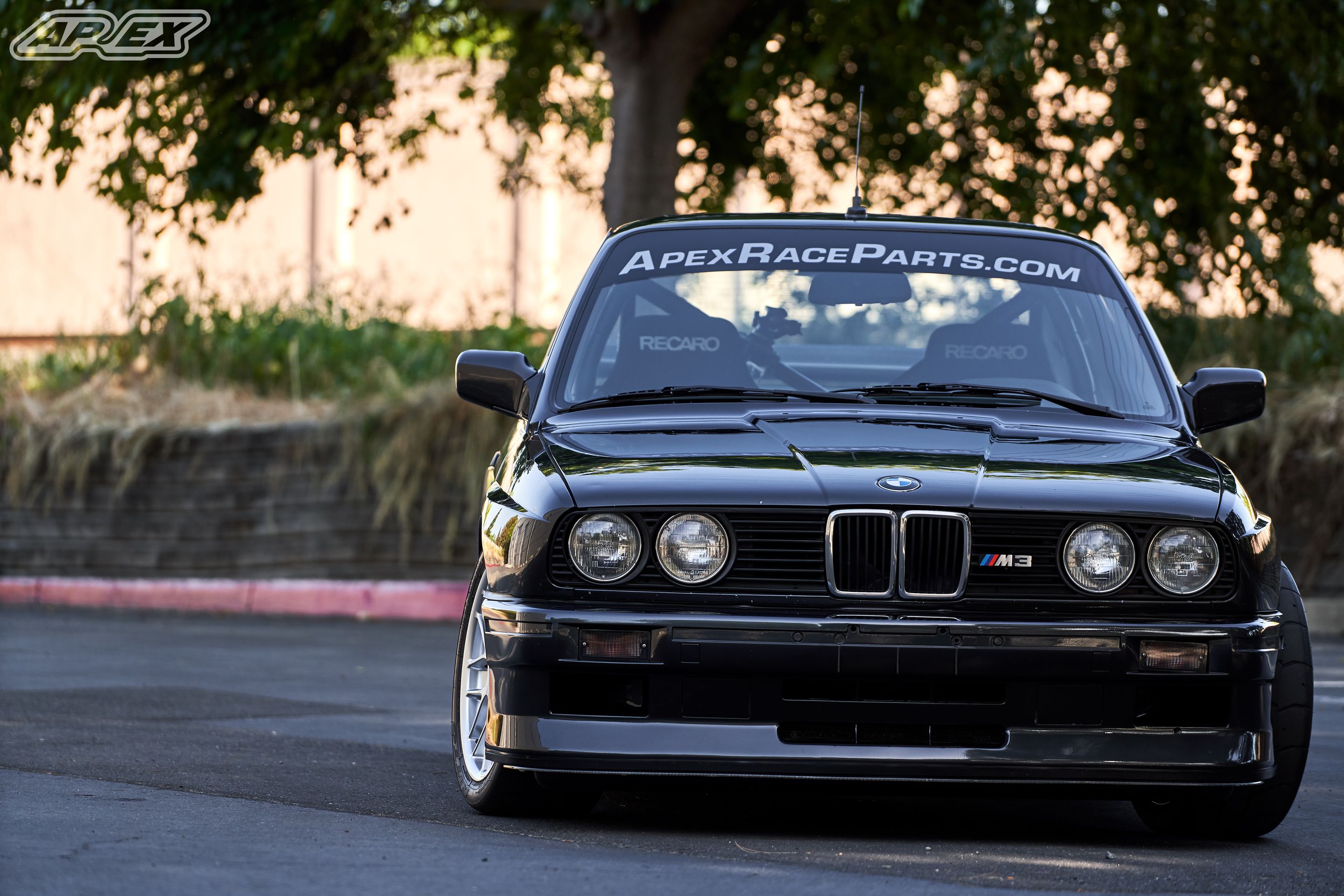 Black BMW E30 M3 with 17" ARC-8 Apex wheels in Hyper Silver
