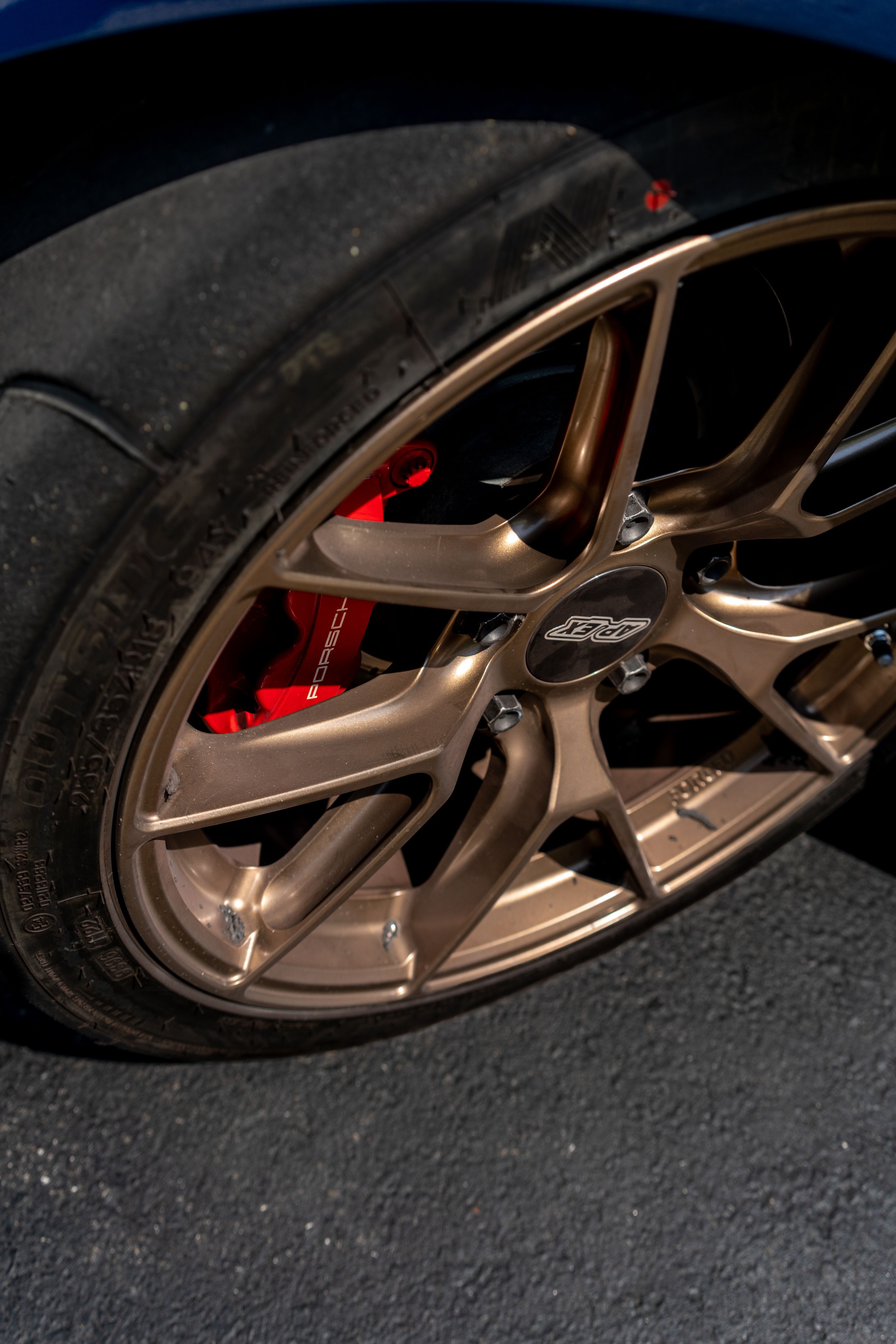 Blue Porsche 981 Cayman GTS with 18" VS-5RS Apex wheels in Satin Bronze