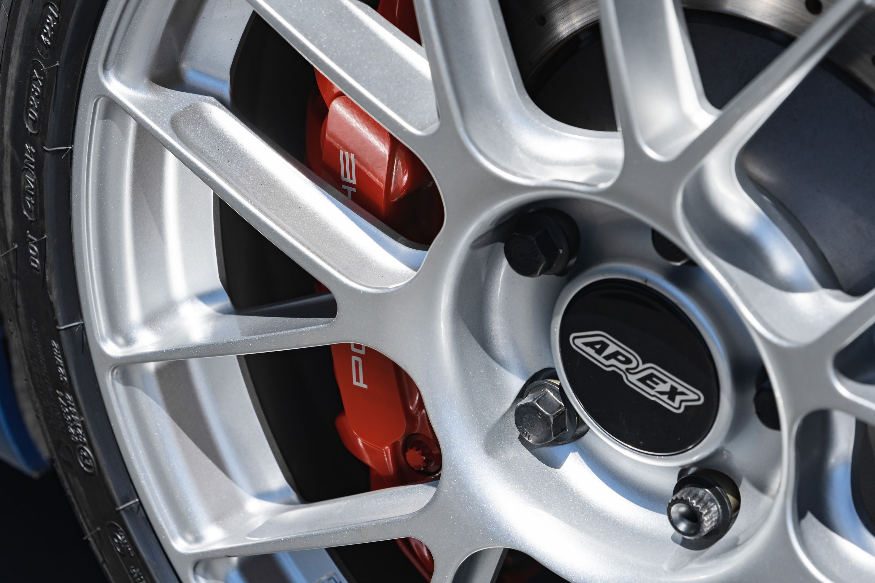 Blue Porsche 981 Cayman GT4 with 19" EC-7RS Apex wheels in Race Silver