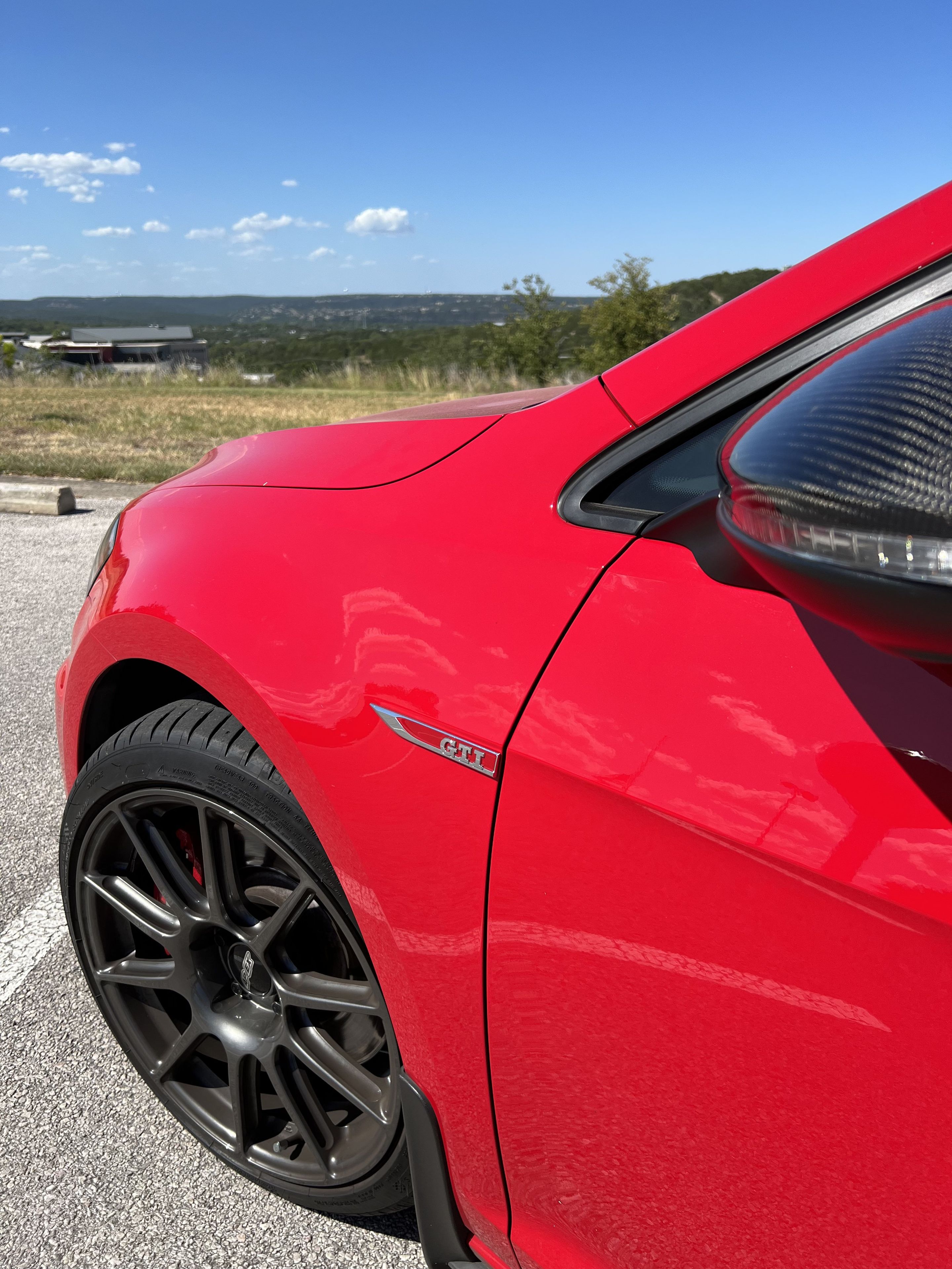 Red VW MK7 GTI with 18" SM-10 Apex wheels in Anthracite