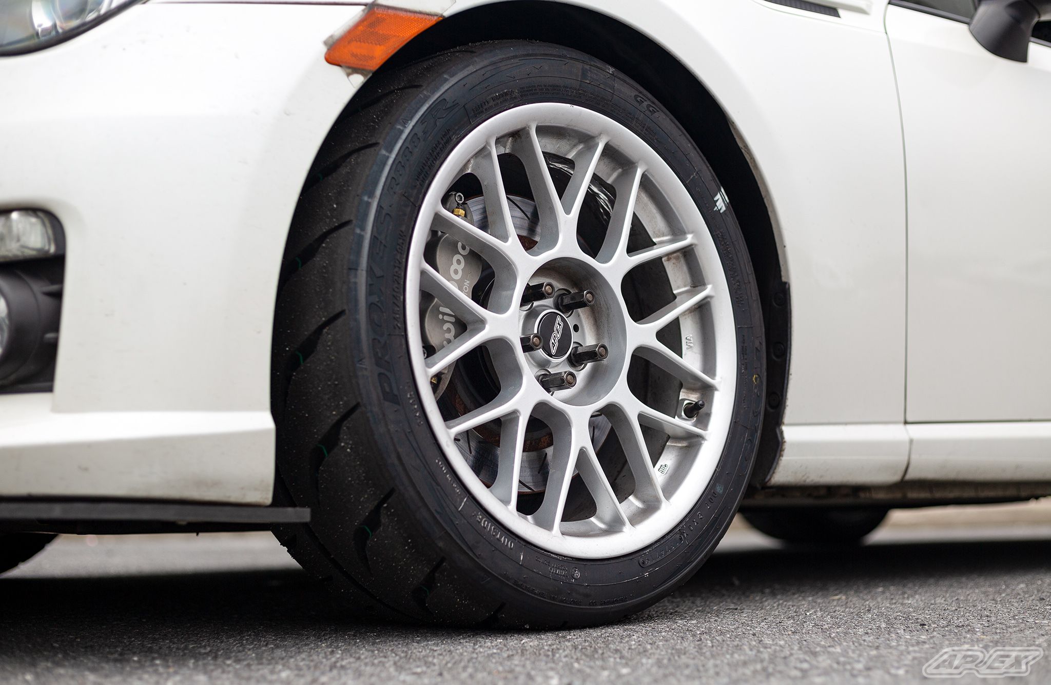 White Subaru ZC6 / Gen 1 BRZ with 17" ARC-8 Apex wheels in Race Silver