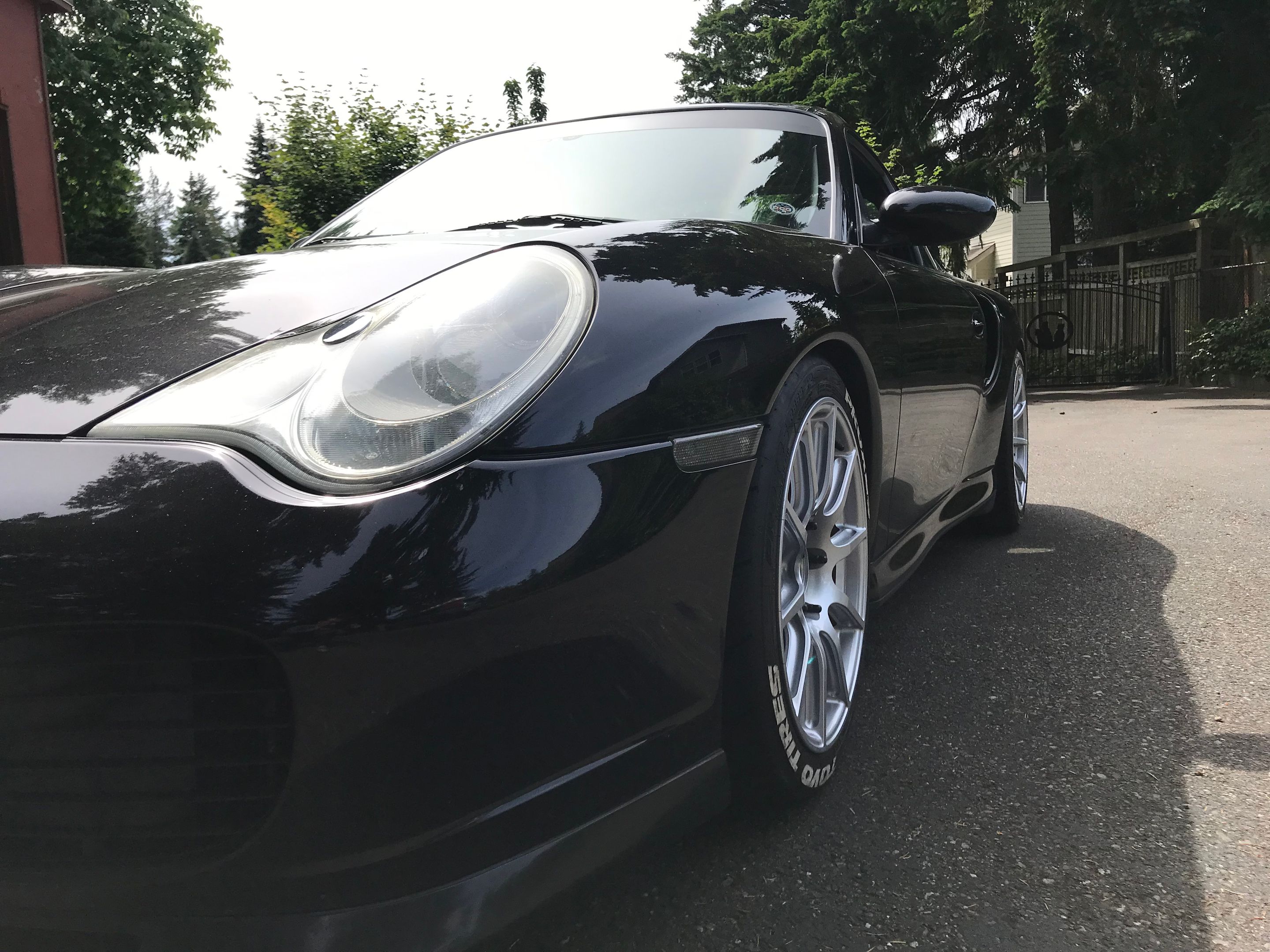 Black Porsche 911 996 Turbo with 18" SM-10 Apex wheels in Race Silver