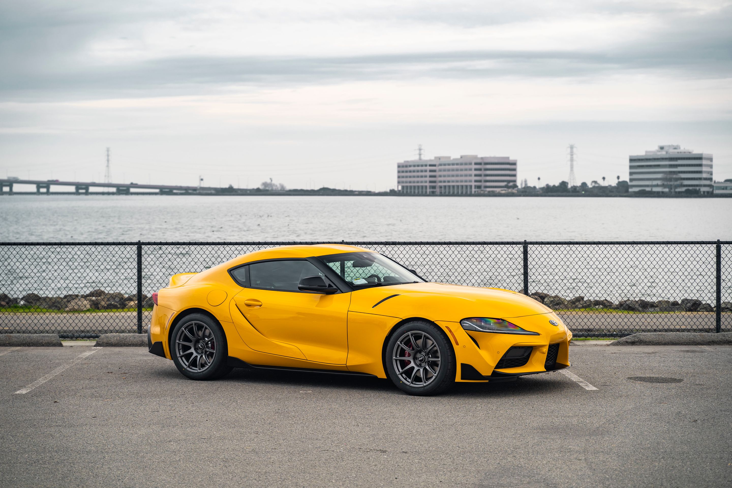 Yellow Toyota GR Supra with 18" SM-10 Apex wheels in Anthracite