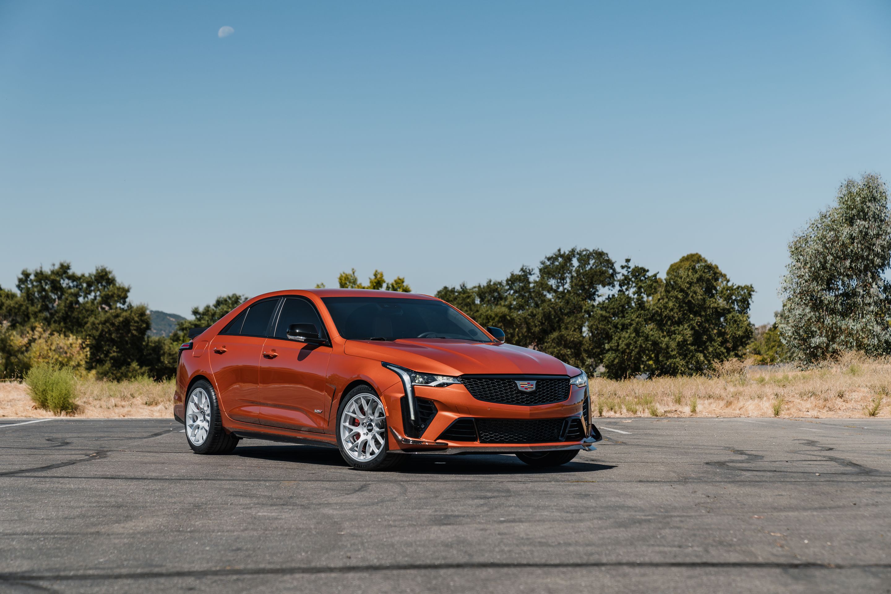 Orange Cadillac CT4-V Blackwing with 18" EC-7 Apex wheels in Race Silver