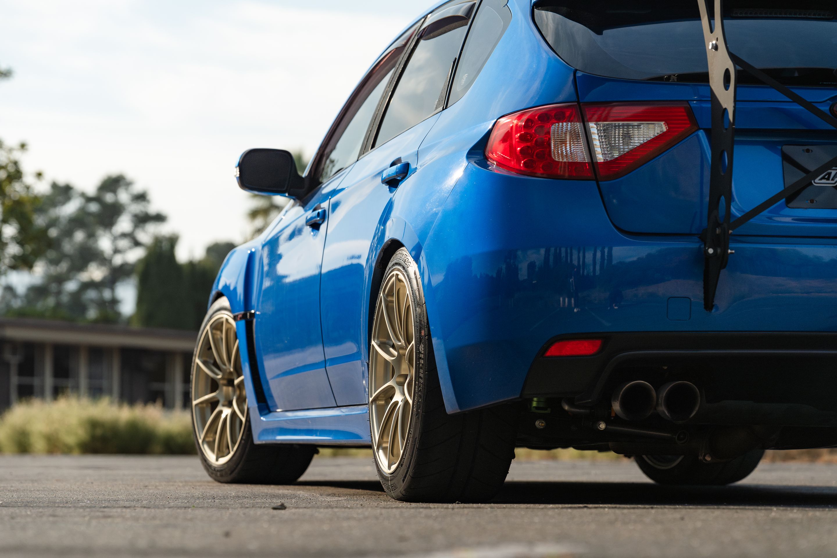 Blue Subaru GR WRX STI with 18" SM-10RS Apex wheels in Motorsport Gold