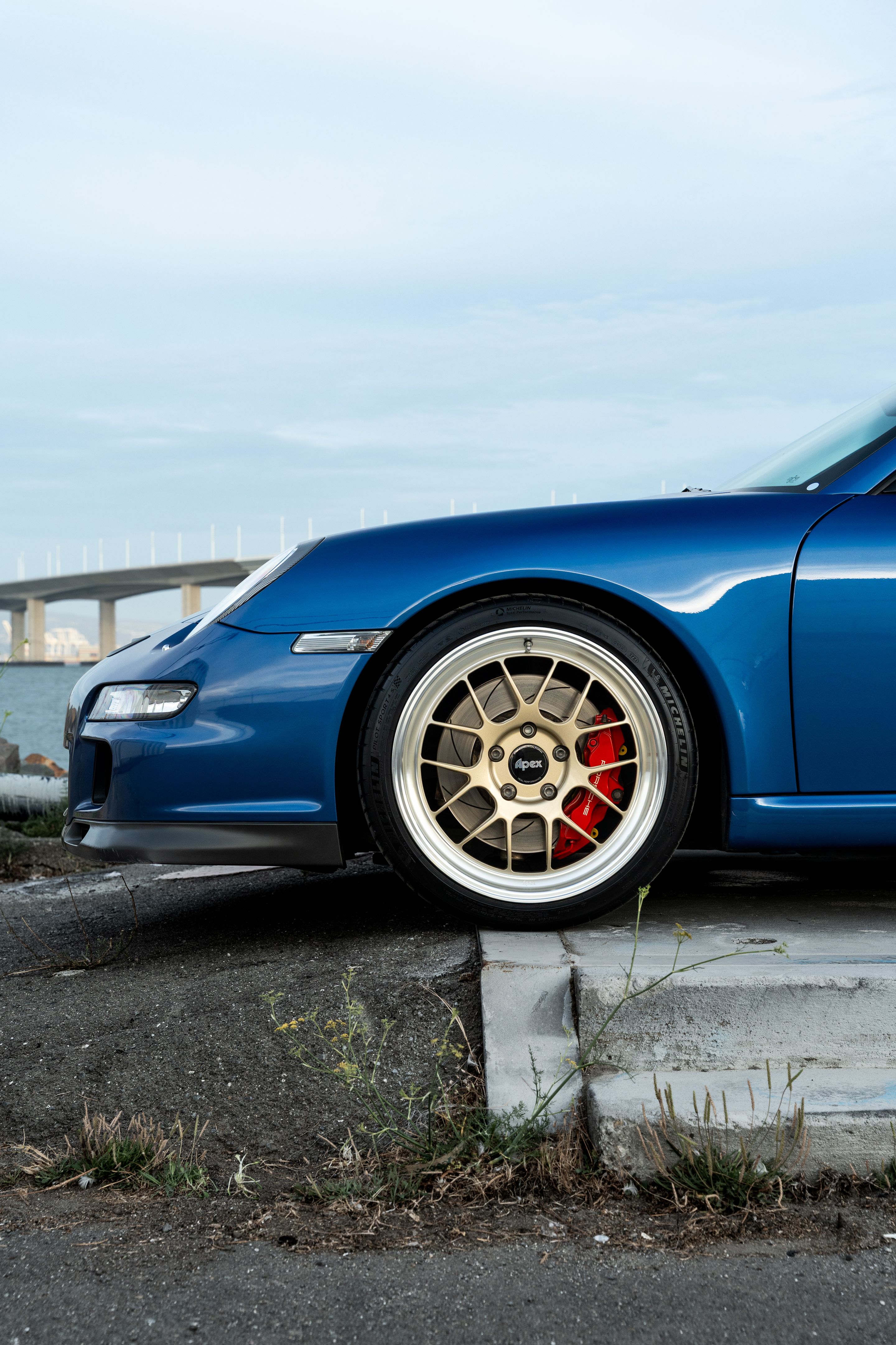 Blue Porsche 911 997 GT3 with 19" TEST-M Apex wheels in Machined Lip Gloss Motorsport Gold