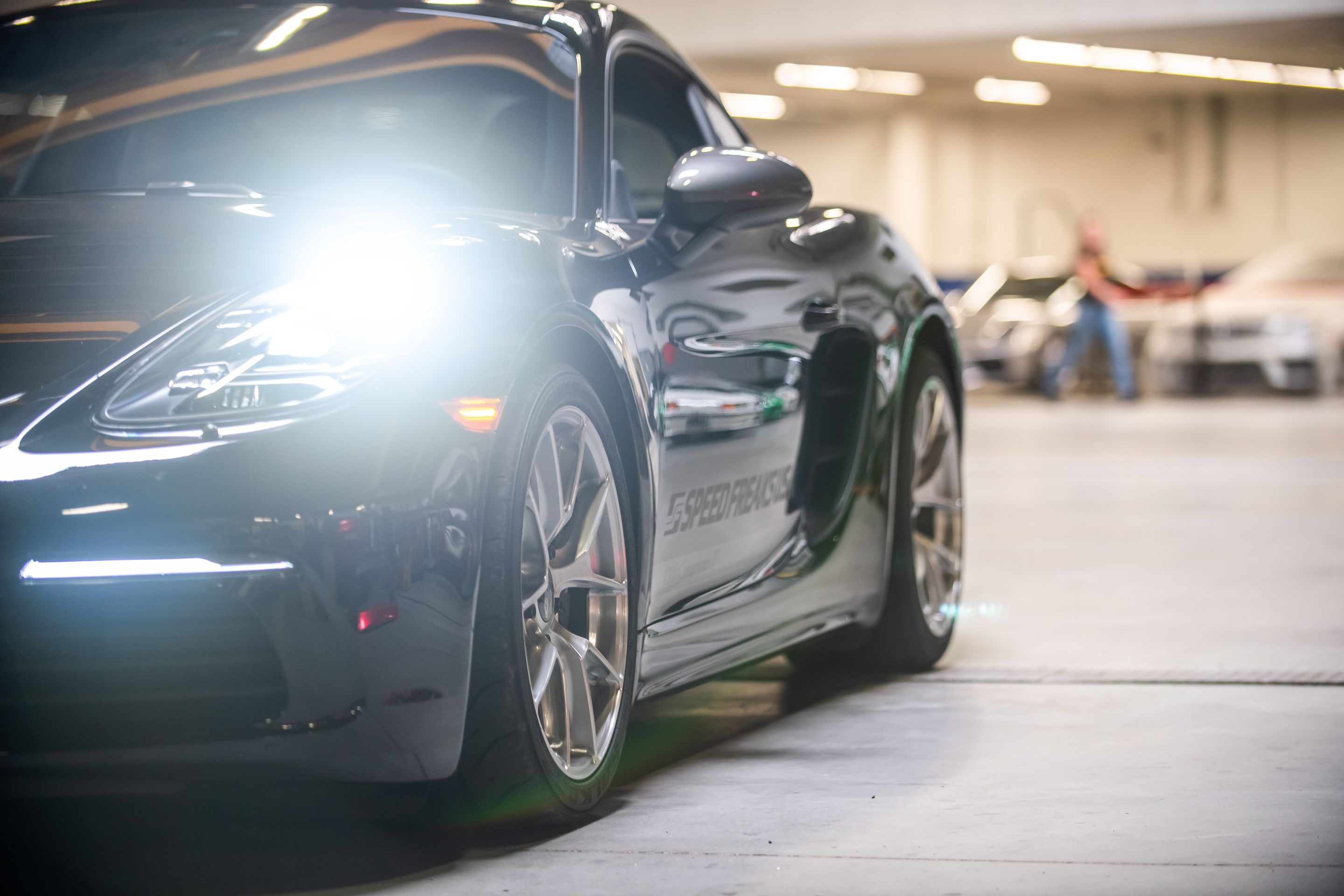 Black Porsche 718 Cayman T with 18" VS-5RS Apex wheels in Brushed Clear