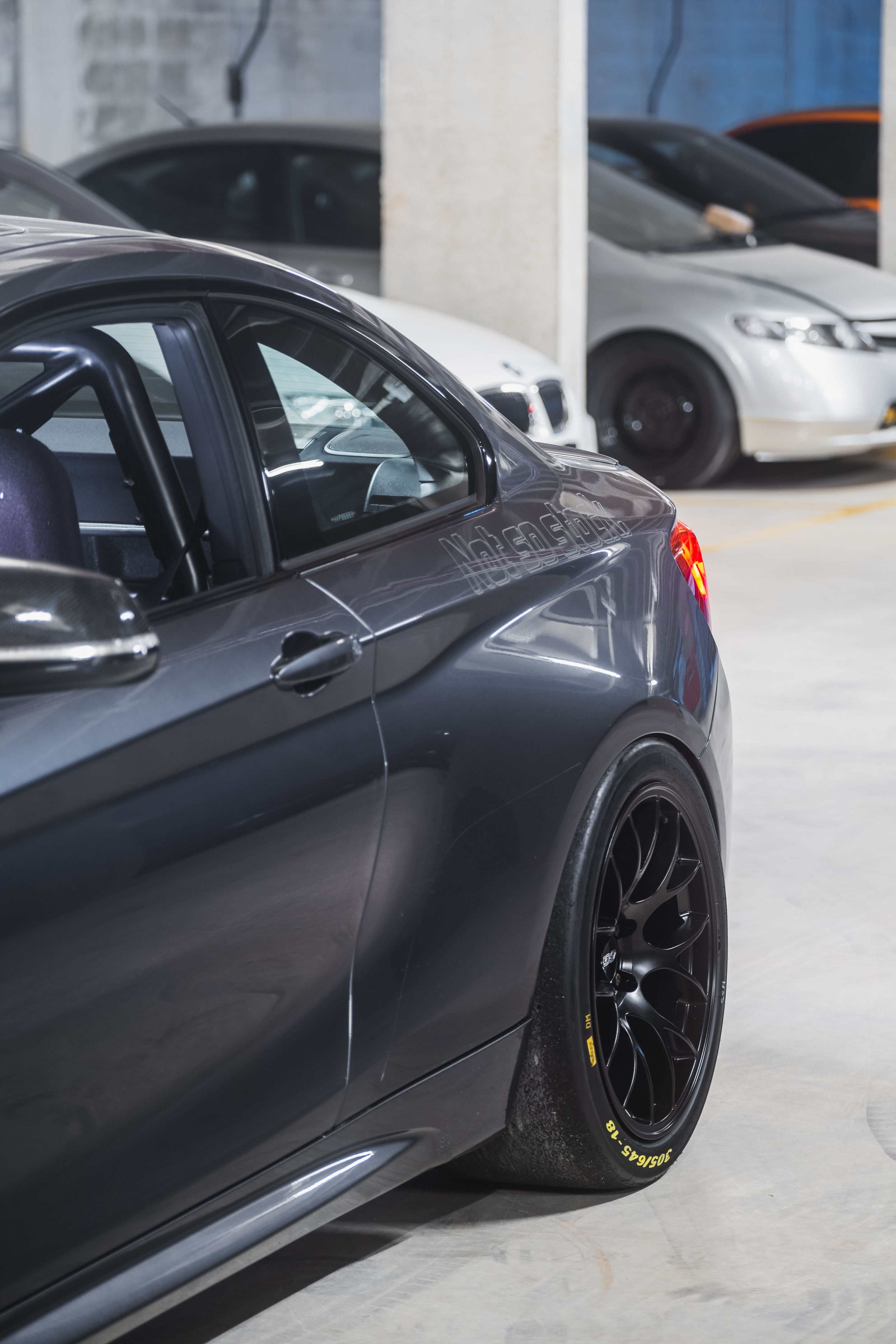 Black BMW F87 M2 with 18" EC-7 Apex wheels in Satin Black