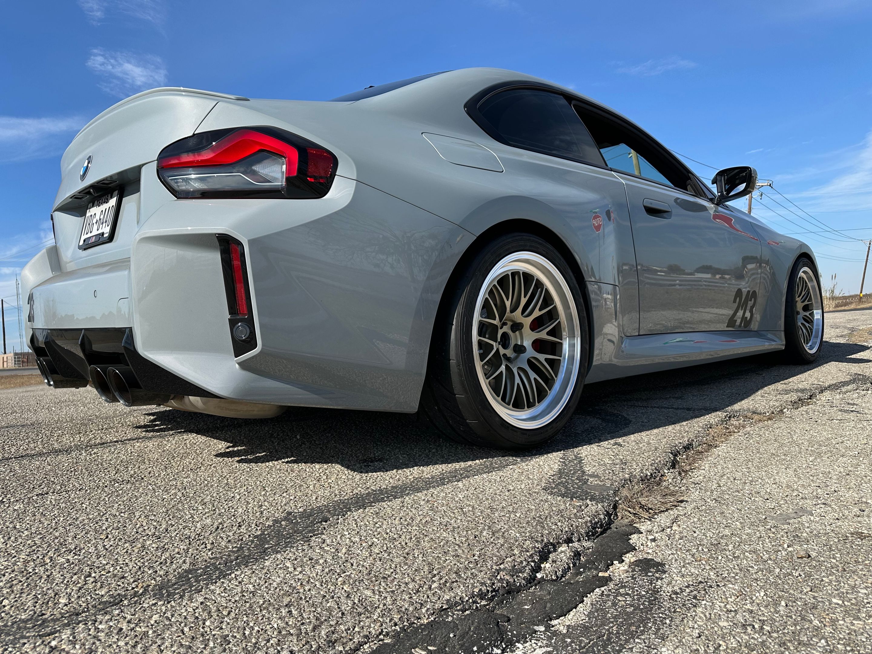 Grey BMW G87 M2 with 19" ML-10RT Apex wheels in Machined Lip Gloss Motorsport Gold