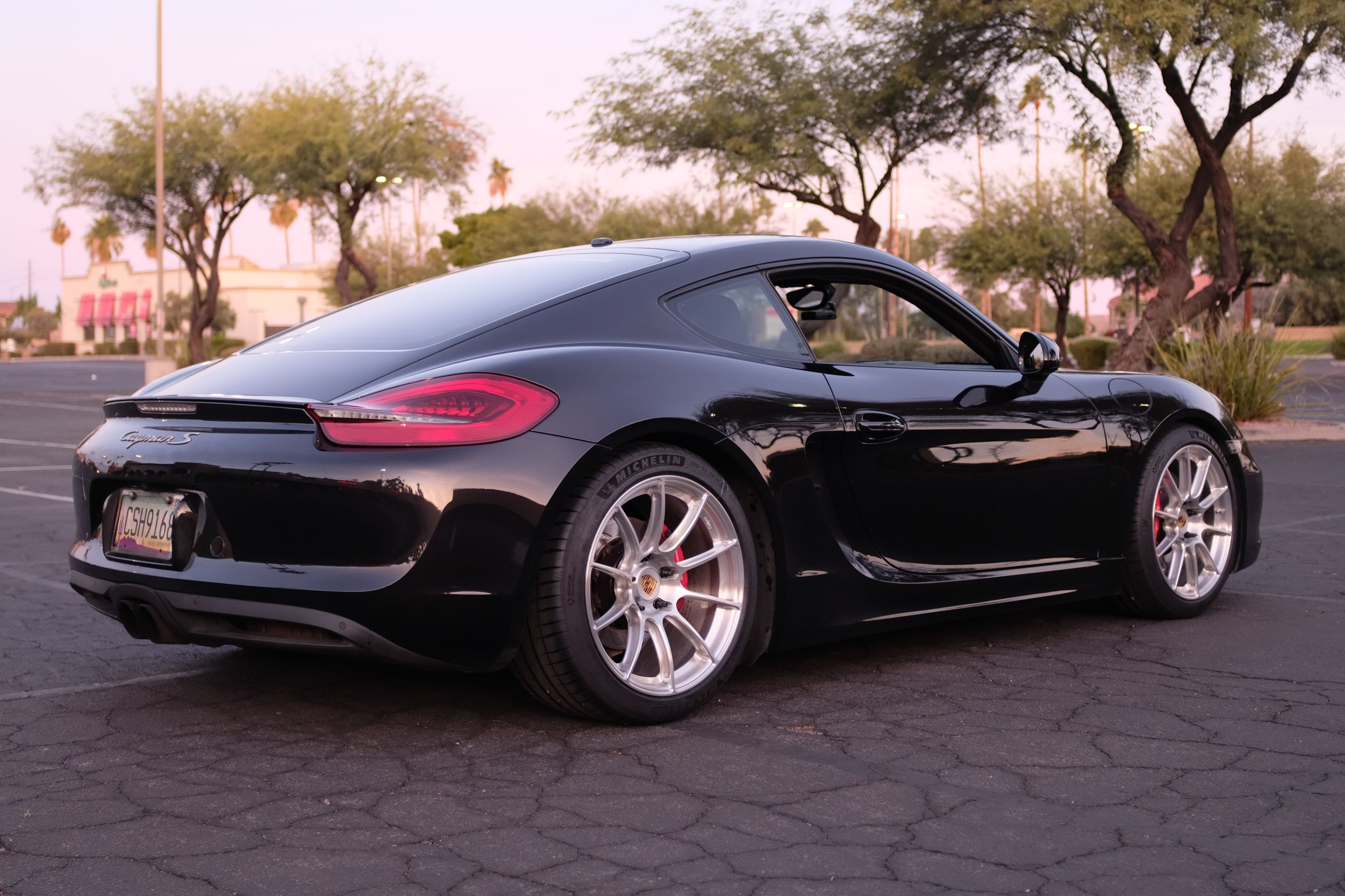 Black Porsche 981 Cayman S with 19" SM-10RS Apex wheels in Brushed Clear