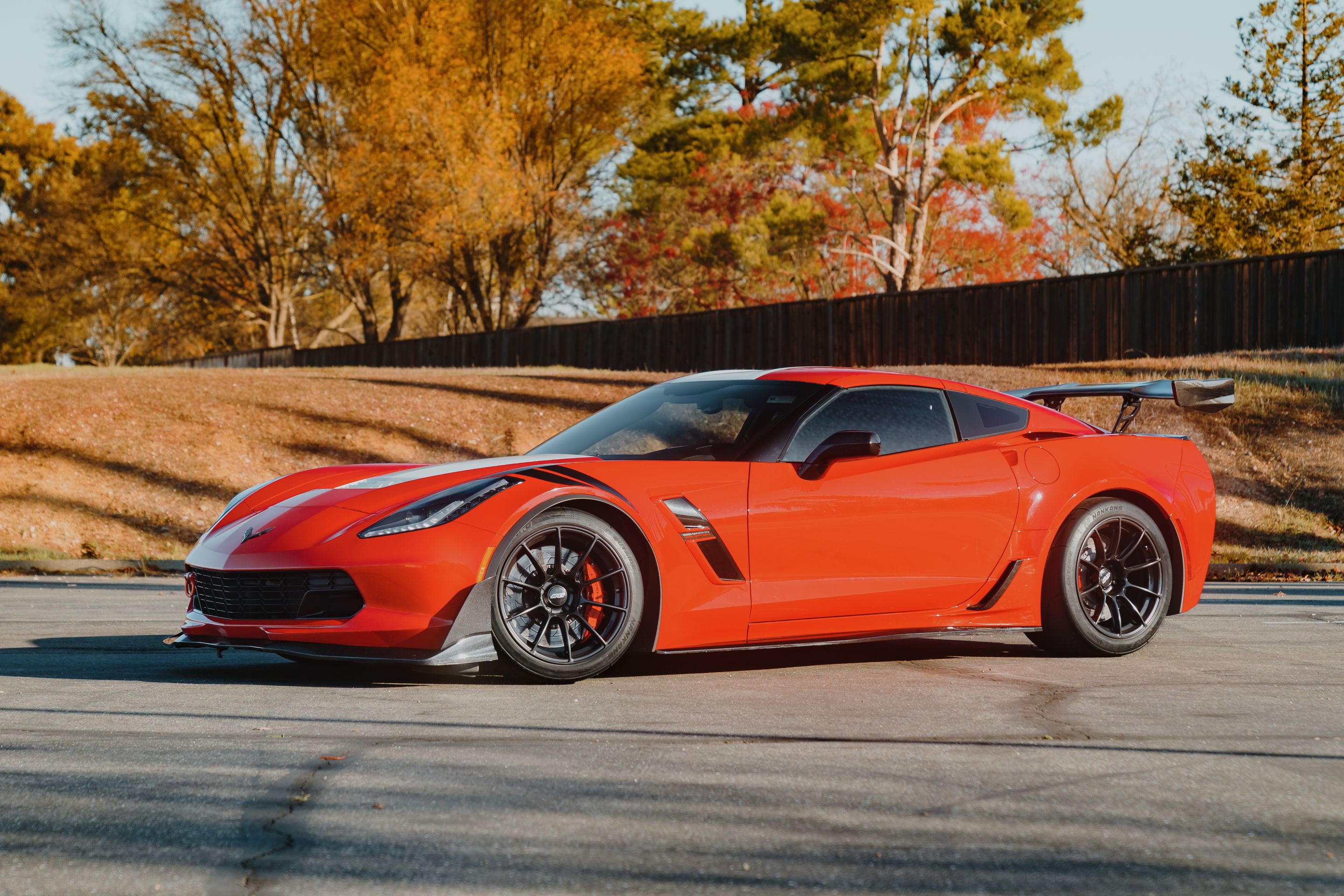 Red Chevrolet C7 Corvette Grand Sport with 18" SM-10RS Apex wheels in Satin Black