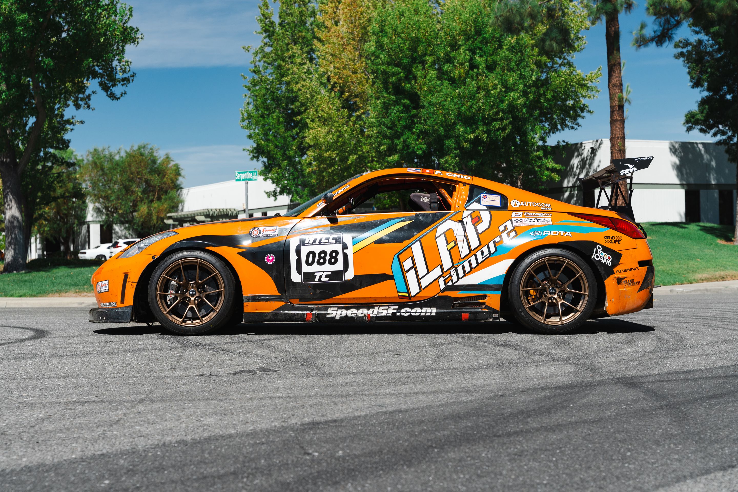 Orange Nissan 350Z with 18" VS-5RS Apex wheels in Satin Bronze