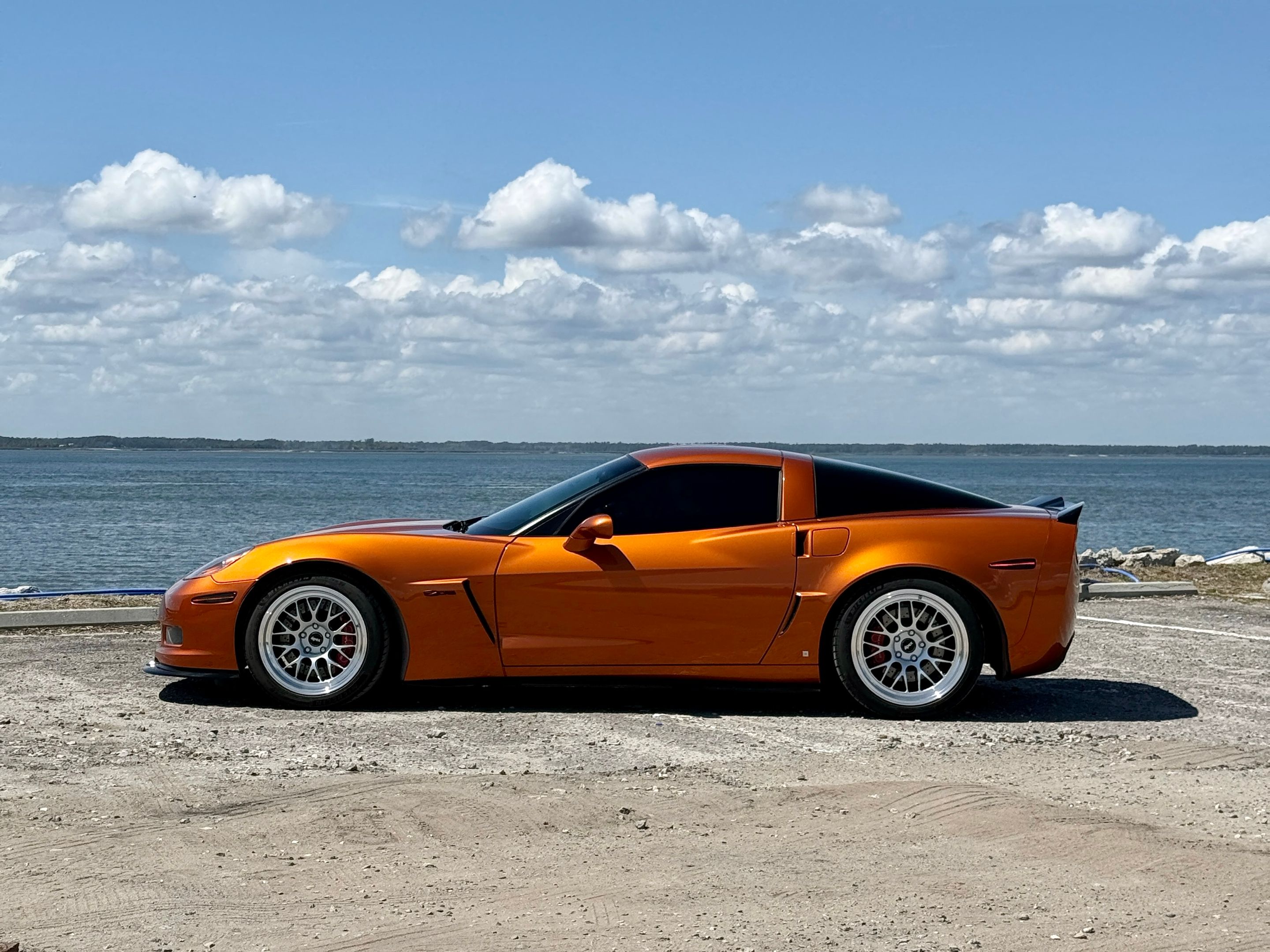 Orange Chevrolet C6 Corvette Z06 with 18"/19" ML-10RT Apex wheels in Machined Lip Race Silver