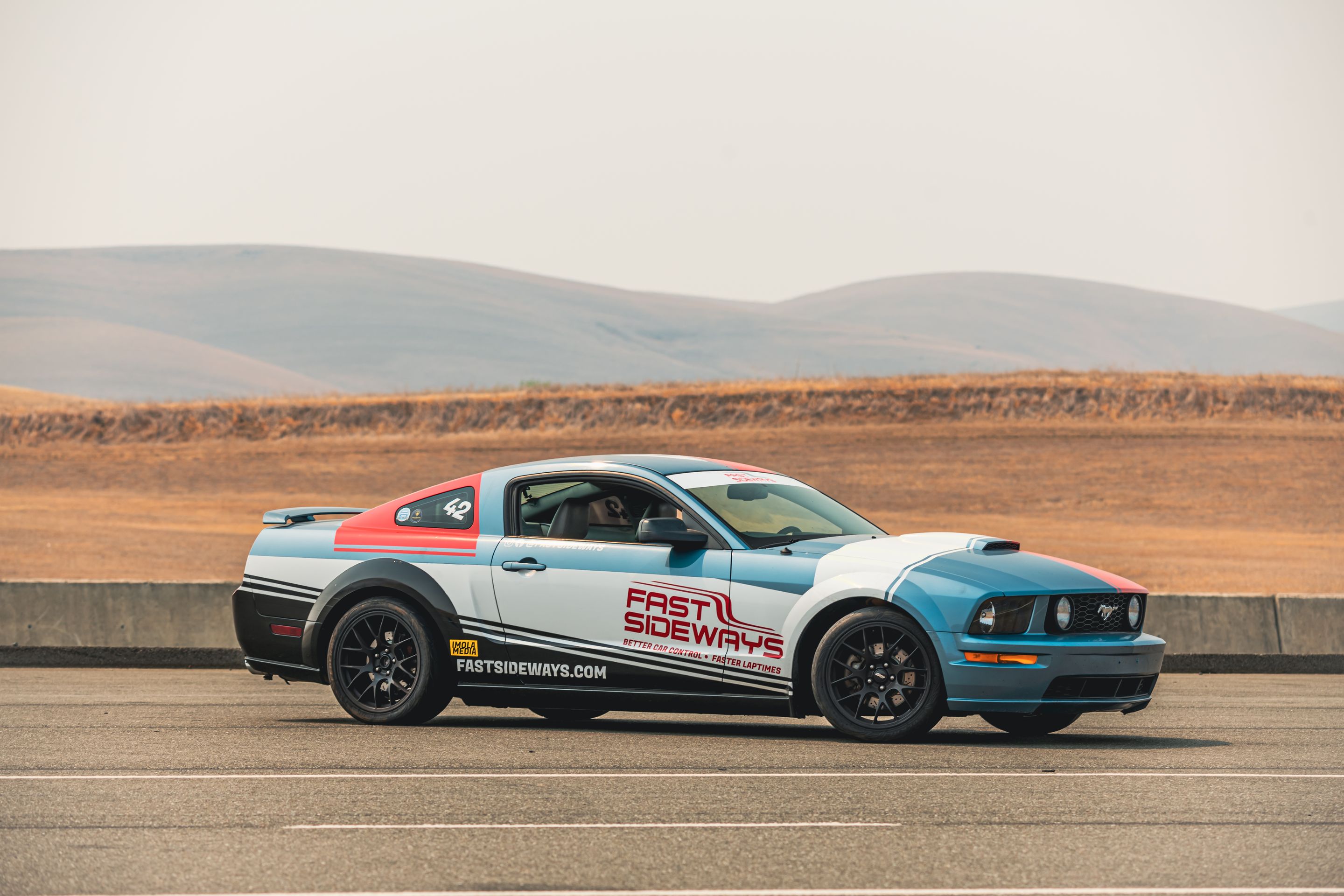 Multicolor Ford S197 Mustang GT with 18" EC-7 Apex wheels in Satin Black