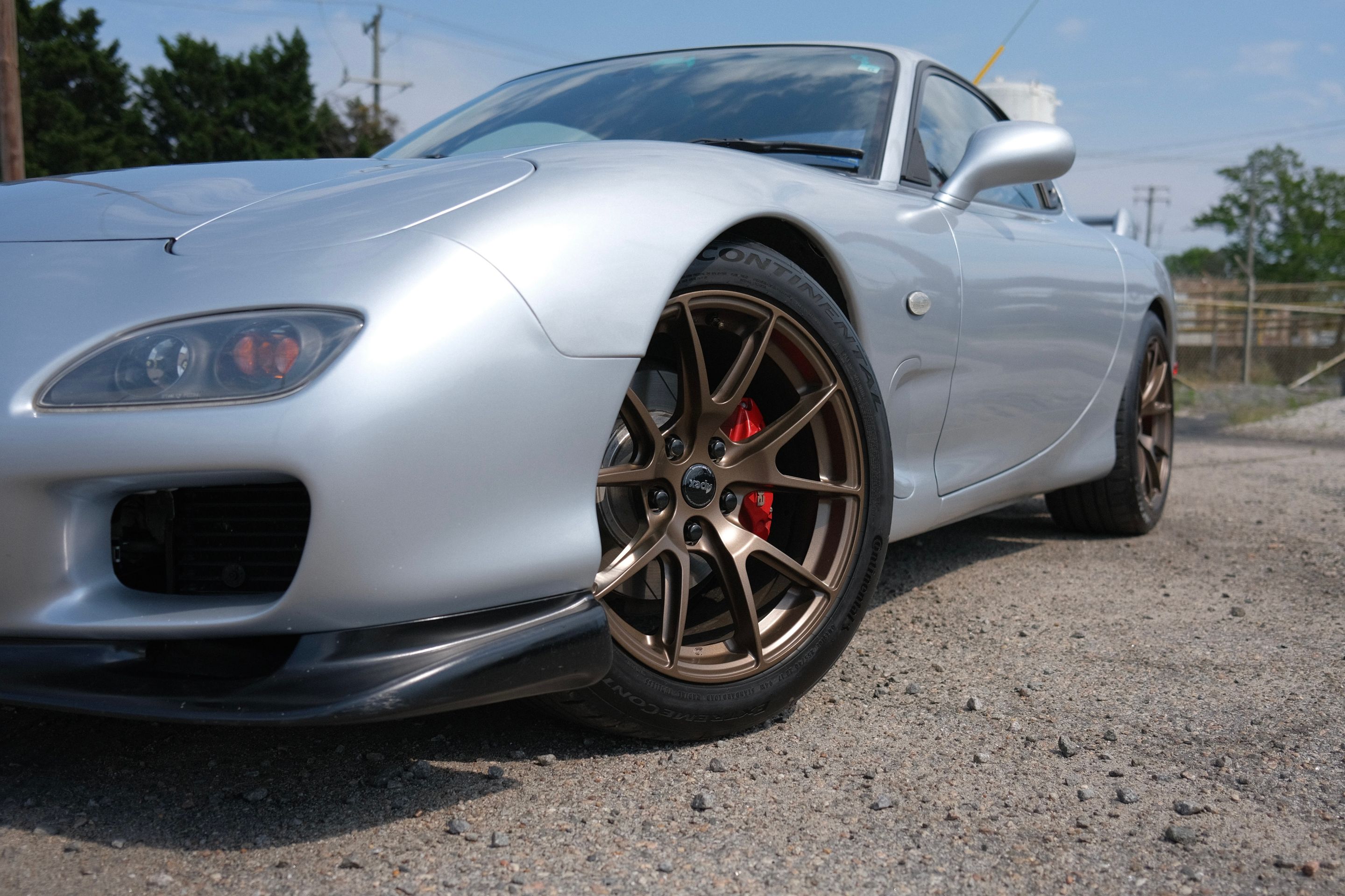 Silver Mazda FD RX-7 with 17" VS-5 Apex wheels in Satin Bronze