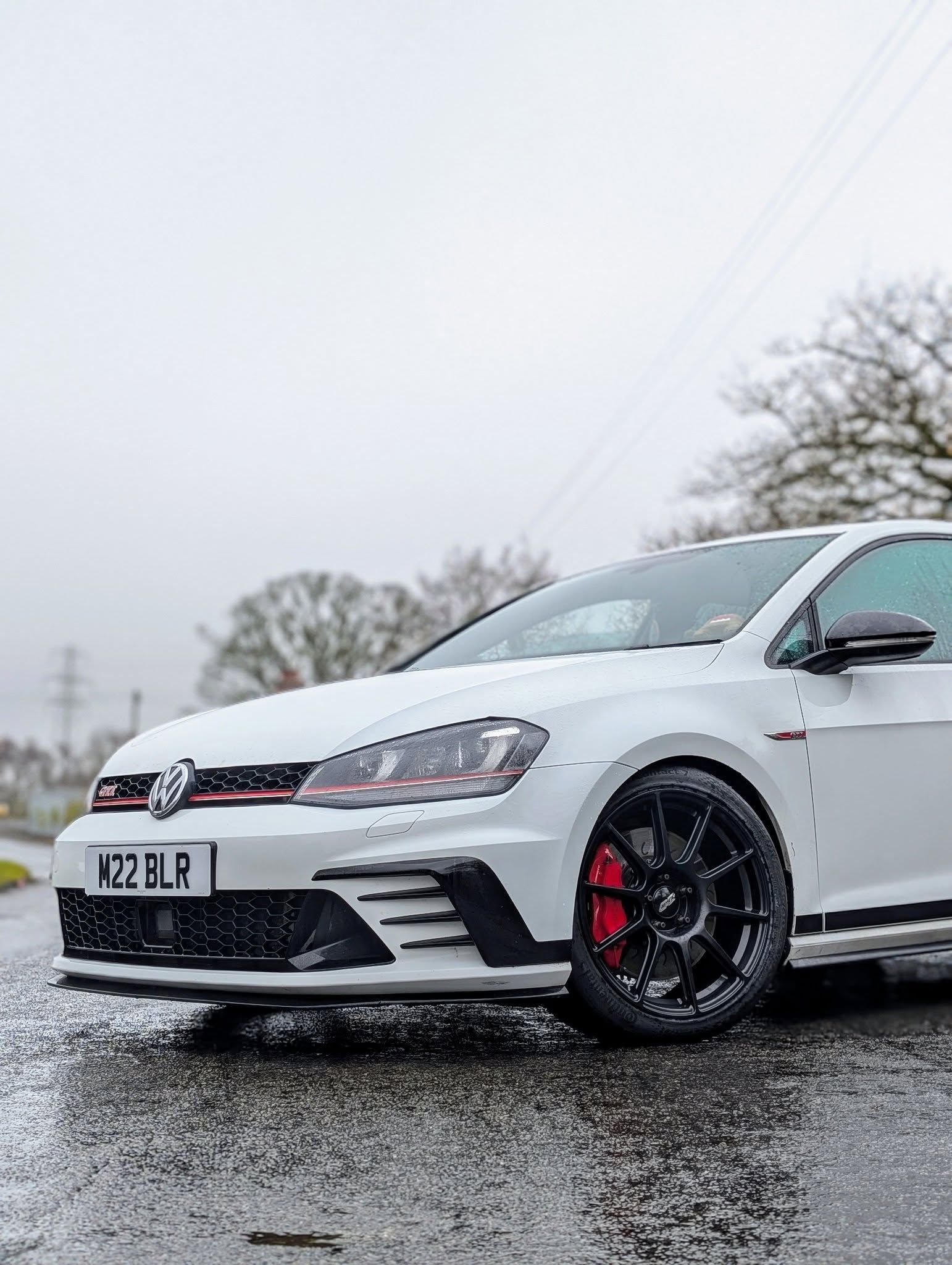 White VW MK7 GTI with 18" SM-10 Apex wheels in Satin Black