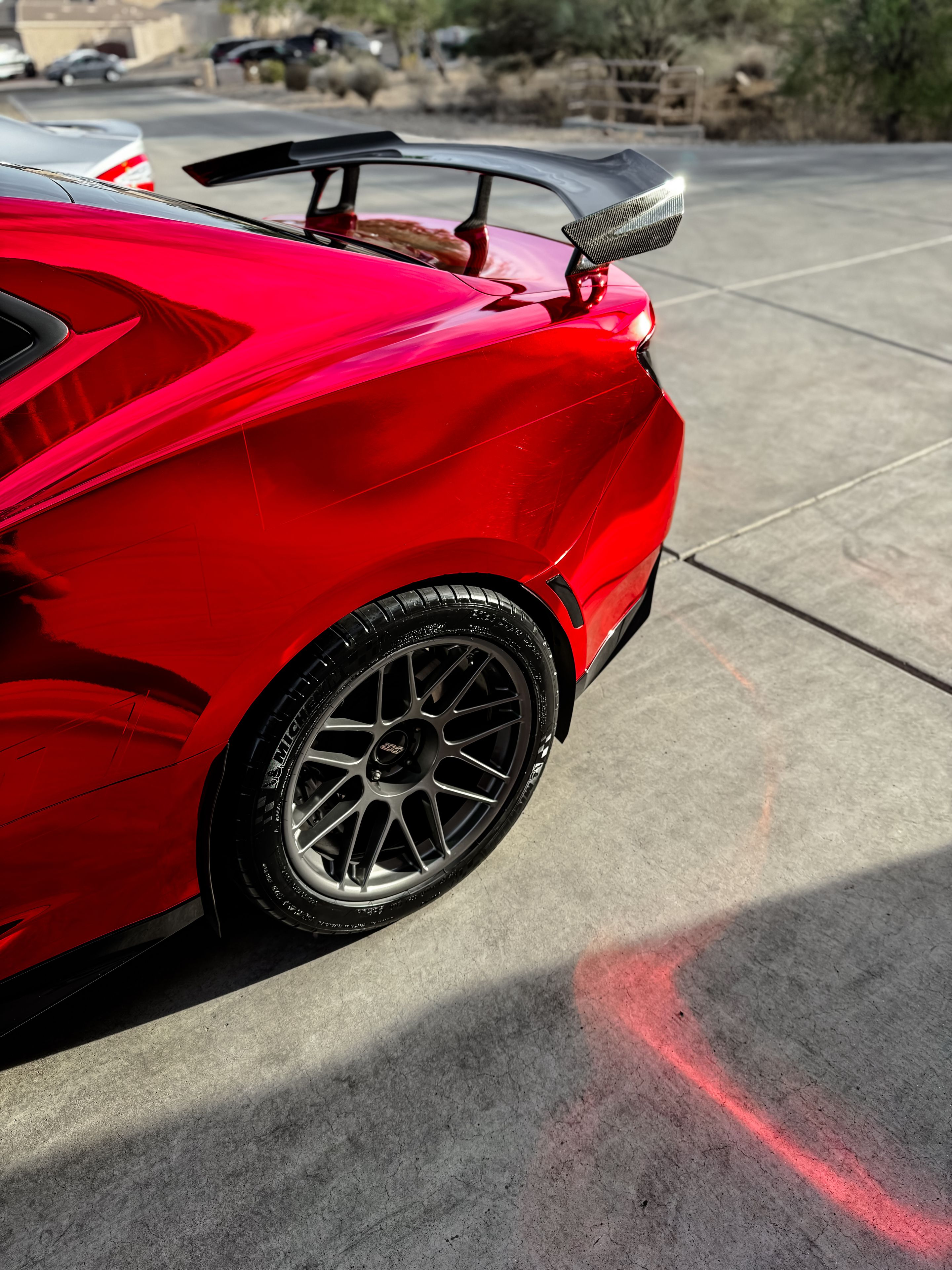 Red Chevrolet 6th Gen Camaro ZL1 with 19" ARC-8 Apex wheels in Anthracite