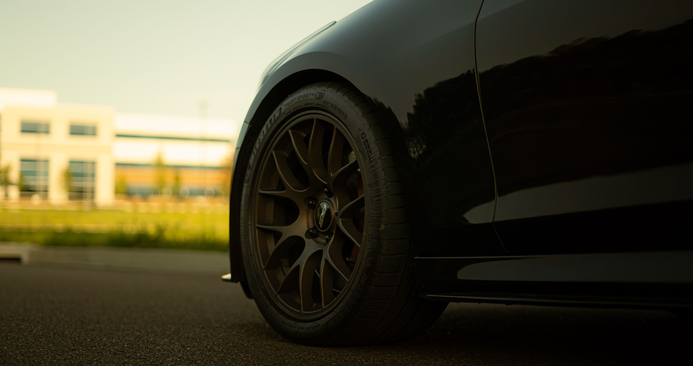 Black Cadillac ATS-V with 18" EC-7 Apex wheels in Satin Bronze