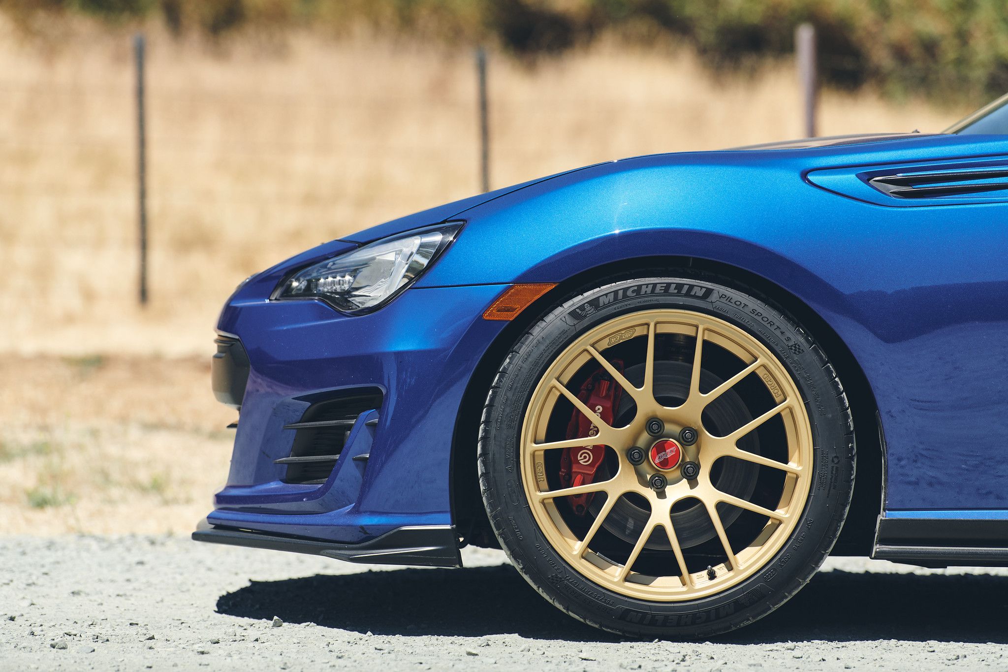 Blue Subaru ZC6 / Gen 1 BRZ with 17" EC-7R Apex wheels in Satin Gold
