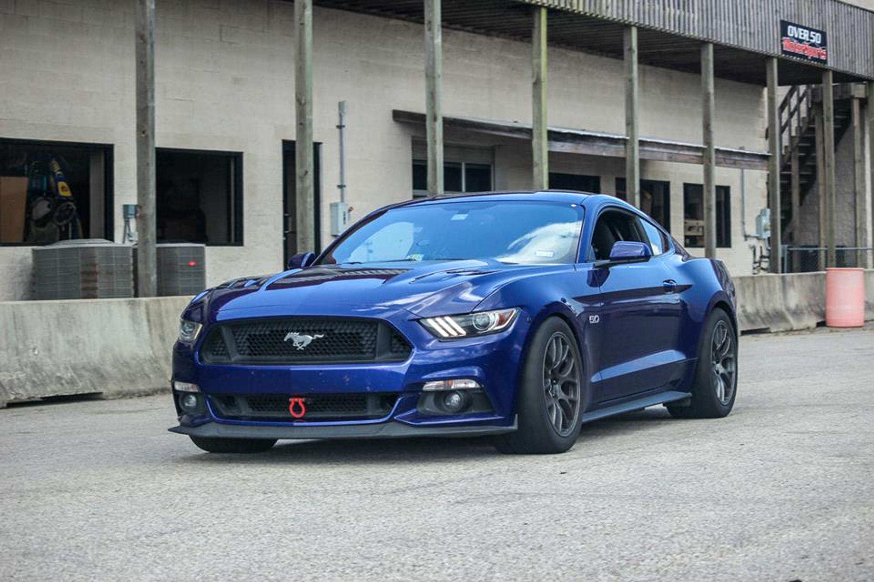 Blue Ford S550 Mustang GT with 18" EC-7 Apex wheels in Anthracite