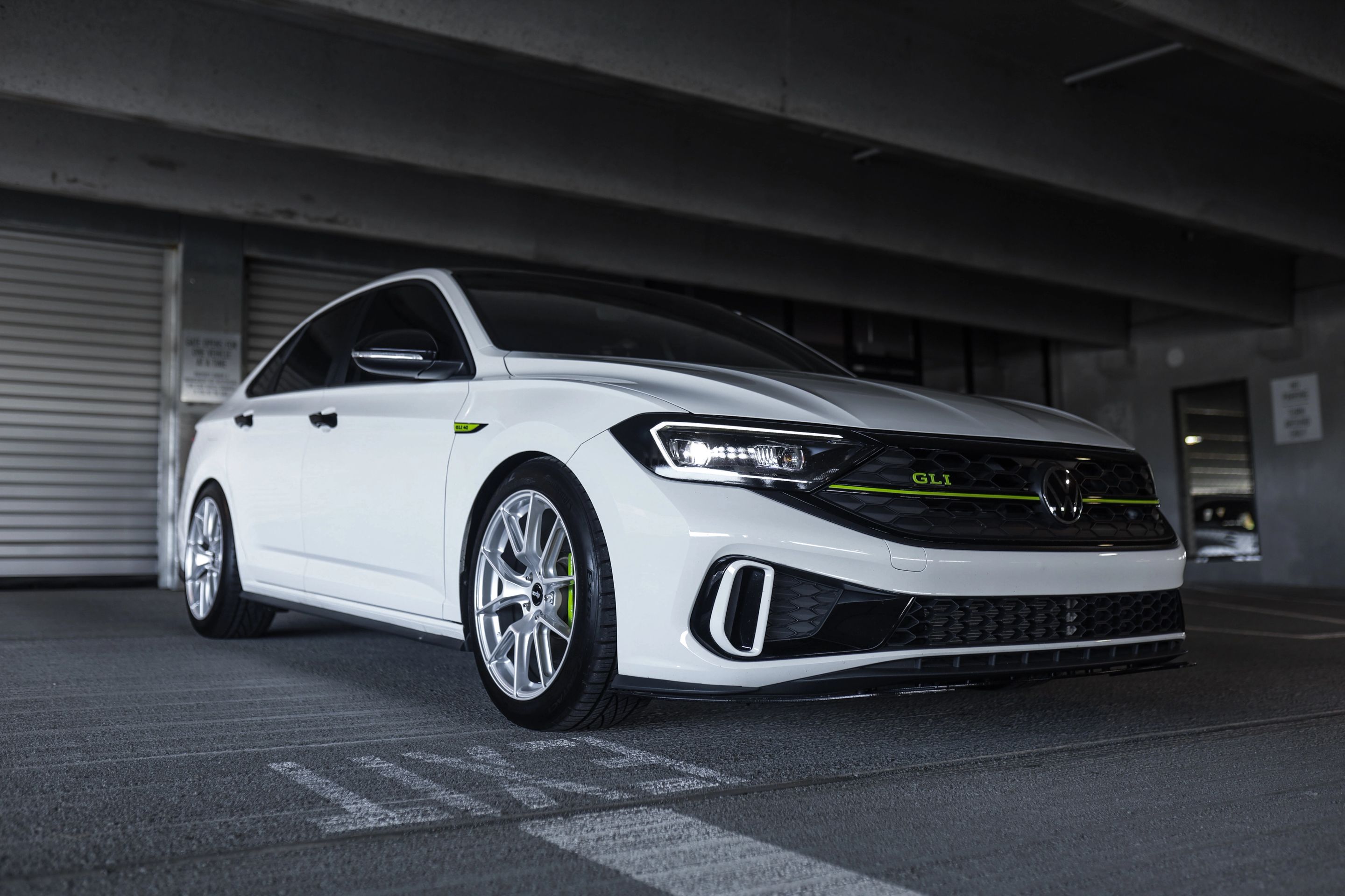 White VW MK7 GLI with 18" VS-5 Apex wheels in Race Silver