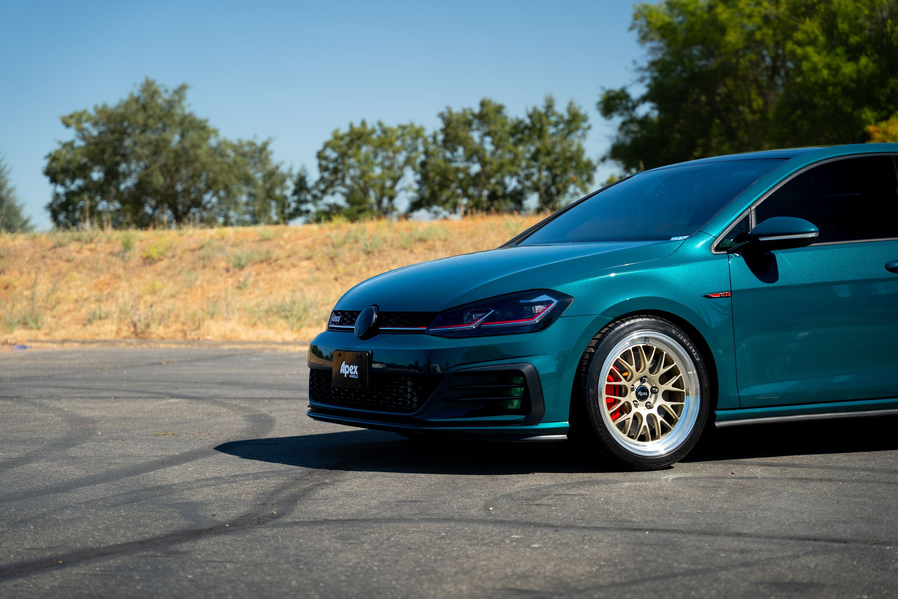 Green VW MK7 GTI with 18" ML-10RT Apex wheels in Machined Lip Gloss Motorsport Gold