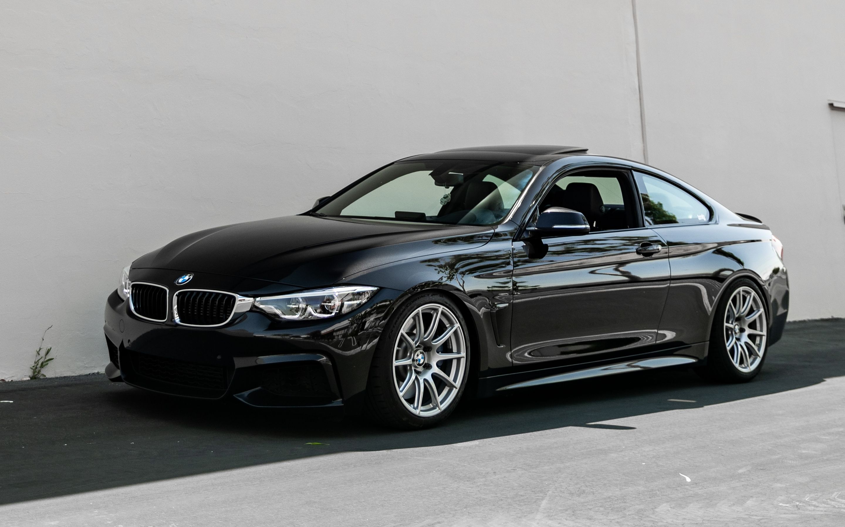 Black BMW F32 Coupe 4 Series with 18" SM-10 Apex wheels in Race Silver