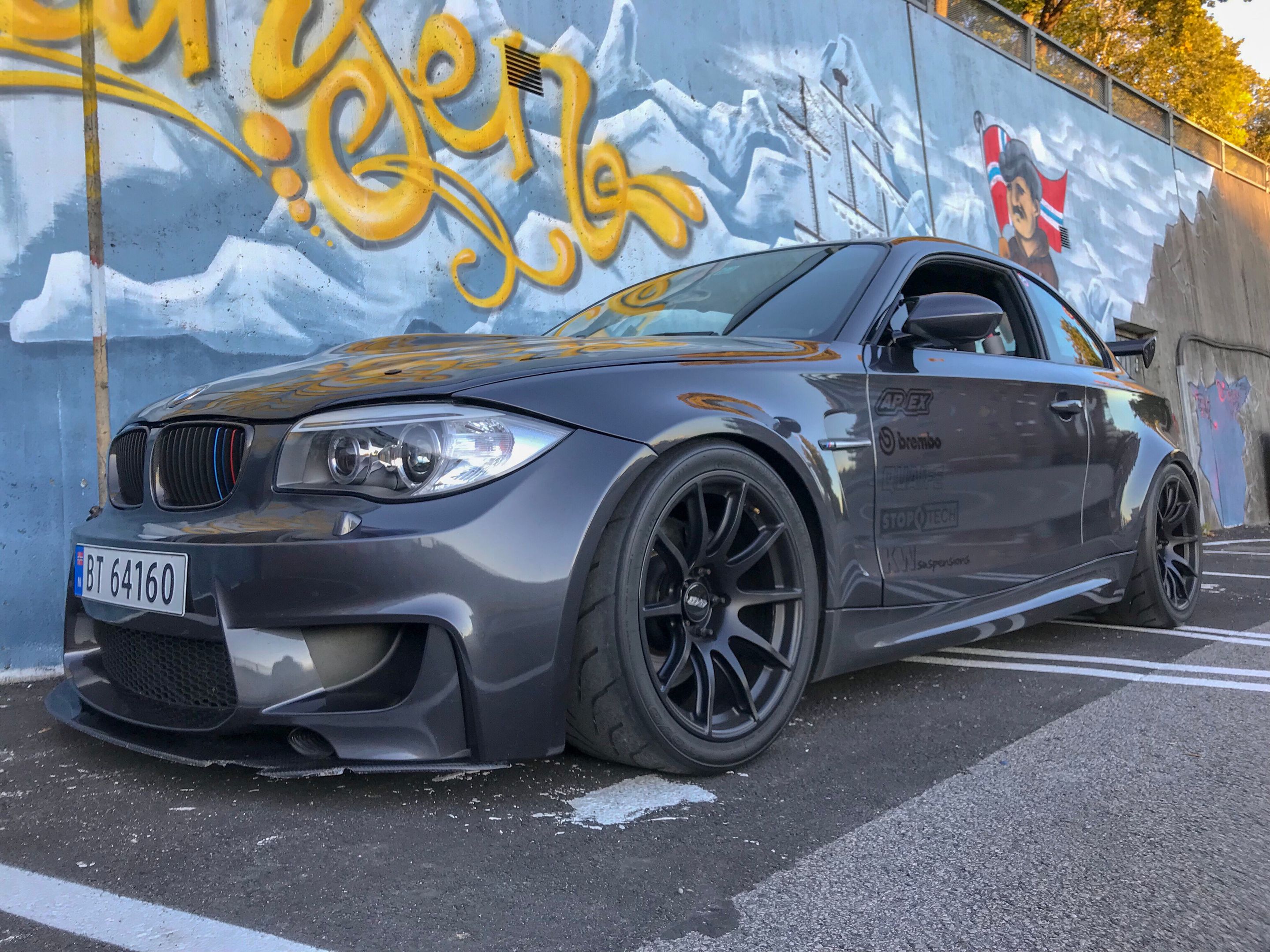 Grey BMW E82 1M with 18" SM-10 Apex wheels in Satin Black